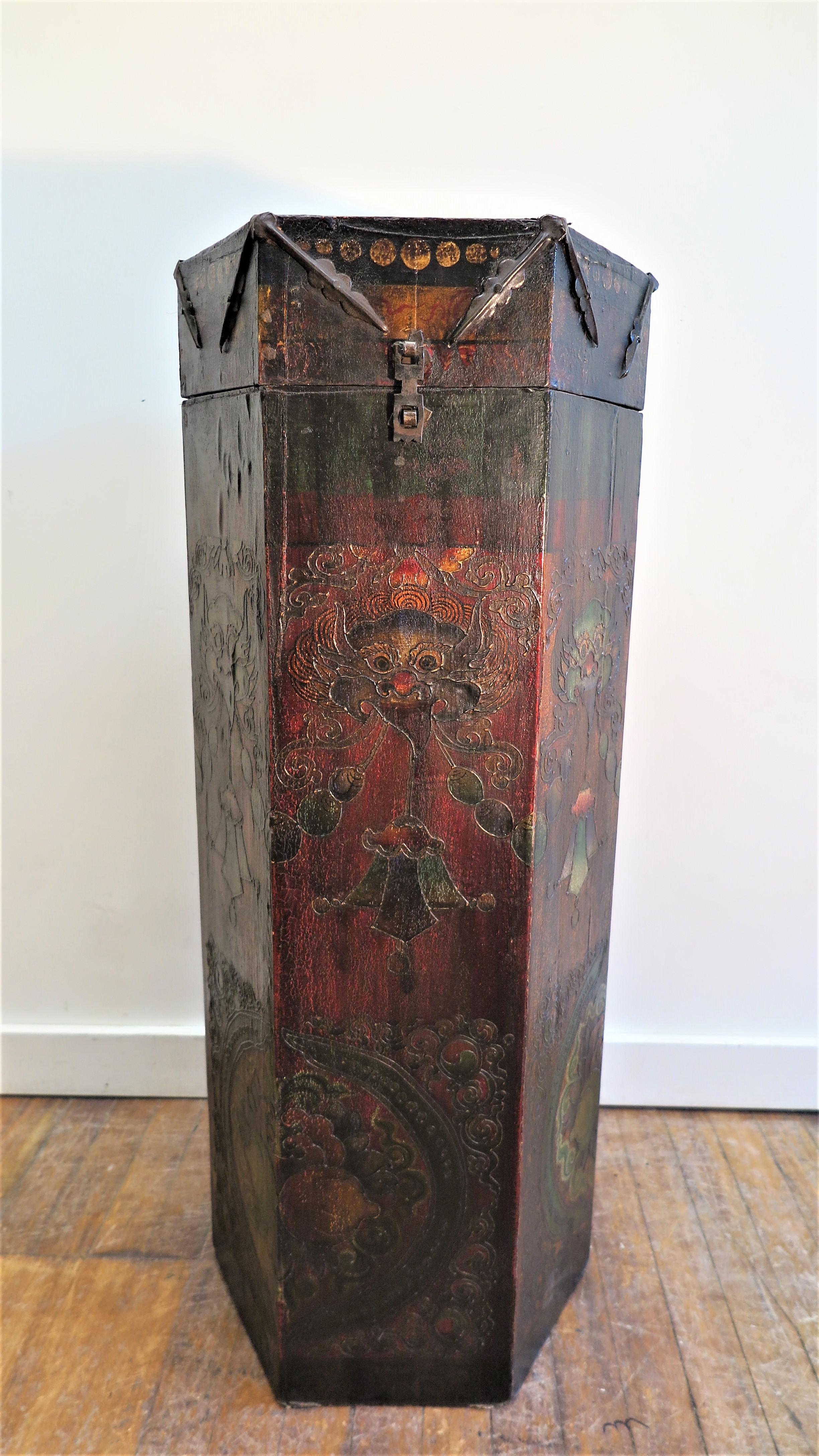 Tibetan hexagon Tonka scroll box. Hand made hexagon box covered in leather hand painted. Traditional Tibetan art work hand painted with raised outlining of Jambhala face, Tibetan Jewels, and Yin Yang symbols adorn all six sides of this box. Used to
