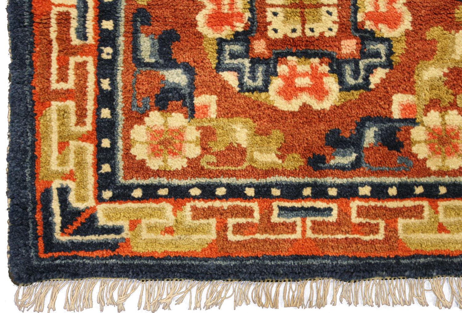 This is a semi-antique Tibetan rug woven during the second quarter of the 20th century circa 1940 and measures 108 x 56 CM in size. This piece is two mat rugs that are originally woven on the same loom and have the exact same design. The field is