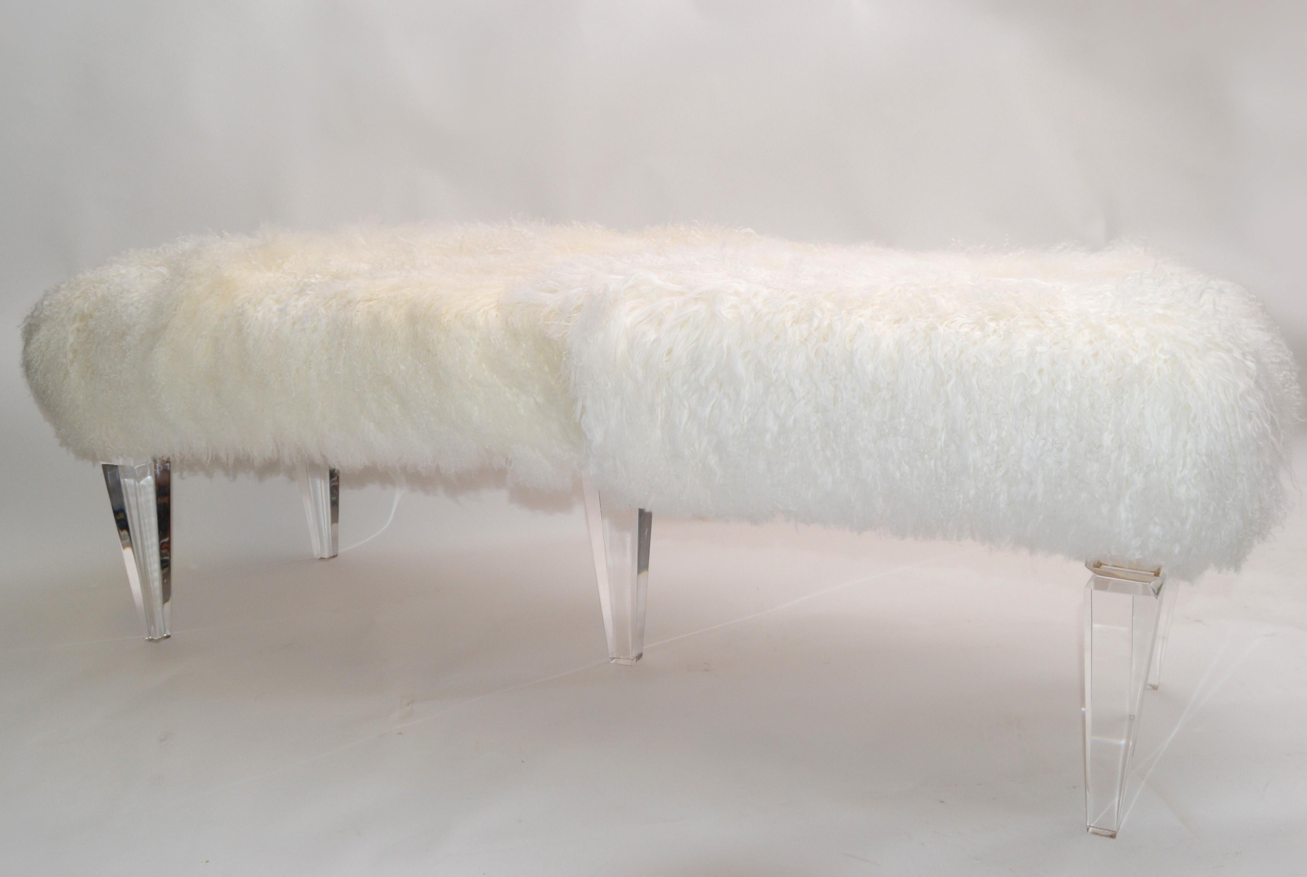 Modern bench with exotic Tibetan sheepskin in ivory.
Fabulous bench has a sturdy platform supported by five custom made Lucite legs.
The Tibetan Sheepskin seating surface is in the original format and can be trimmed if so desired.
New and made to