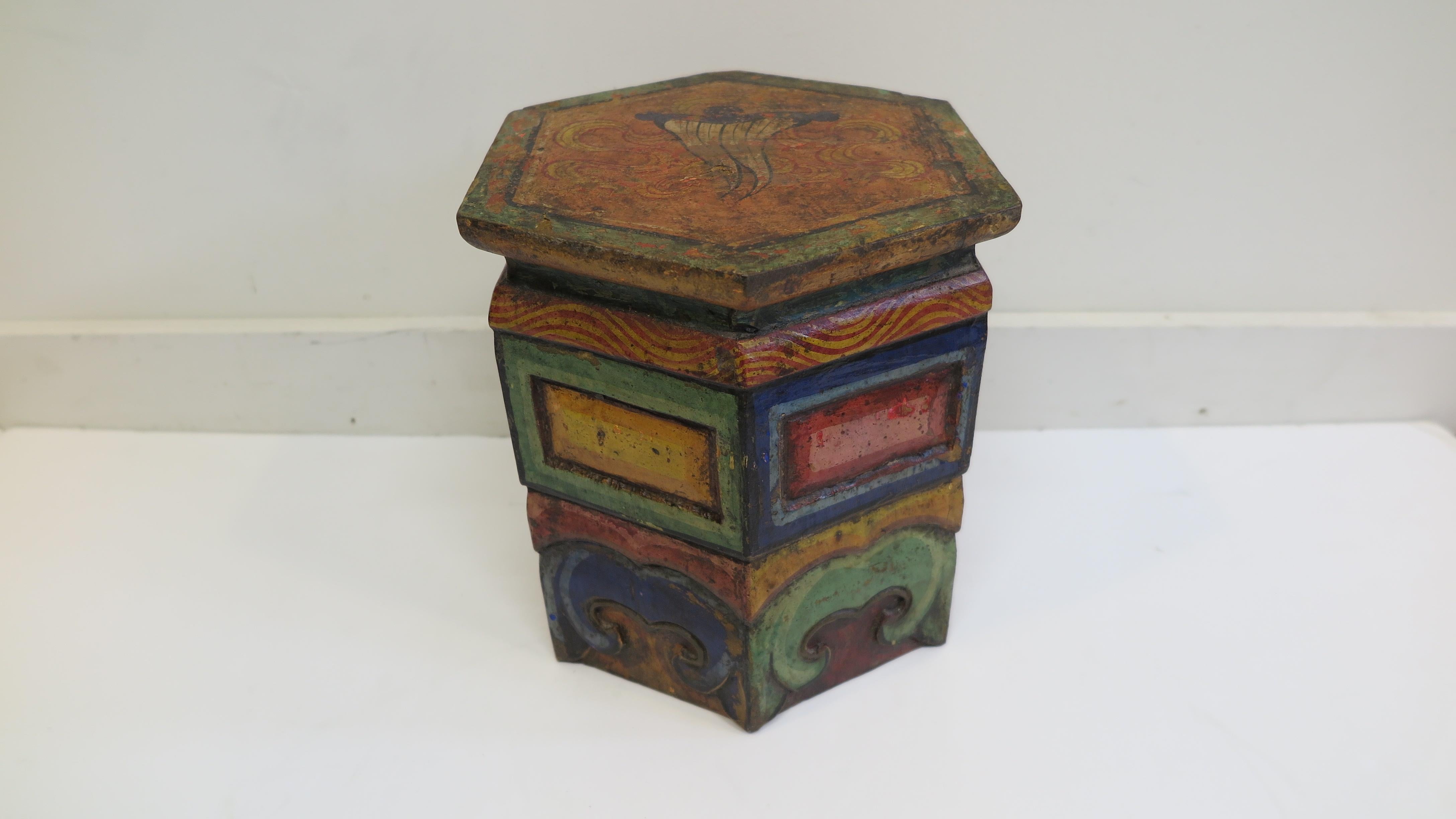 Antique Tibetan stool table. Small traveling stool table used by monks with their practice and for traveling, sometimes used for siting, eating, and offerings. These tables are very small and made with the idea of being travel campions. Nicely