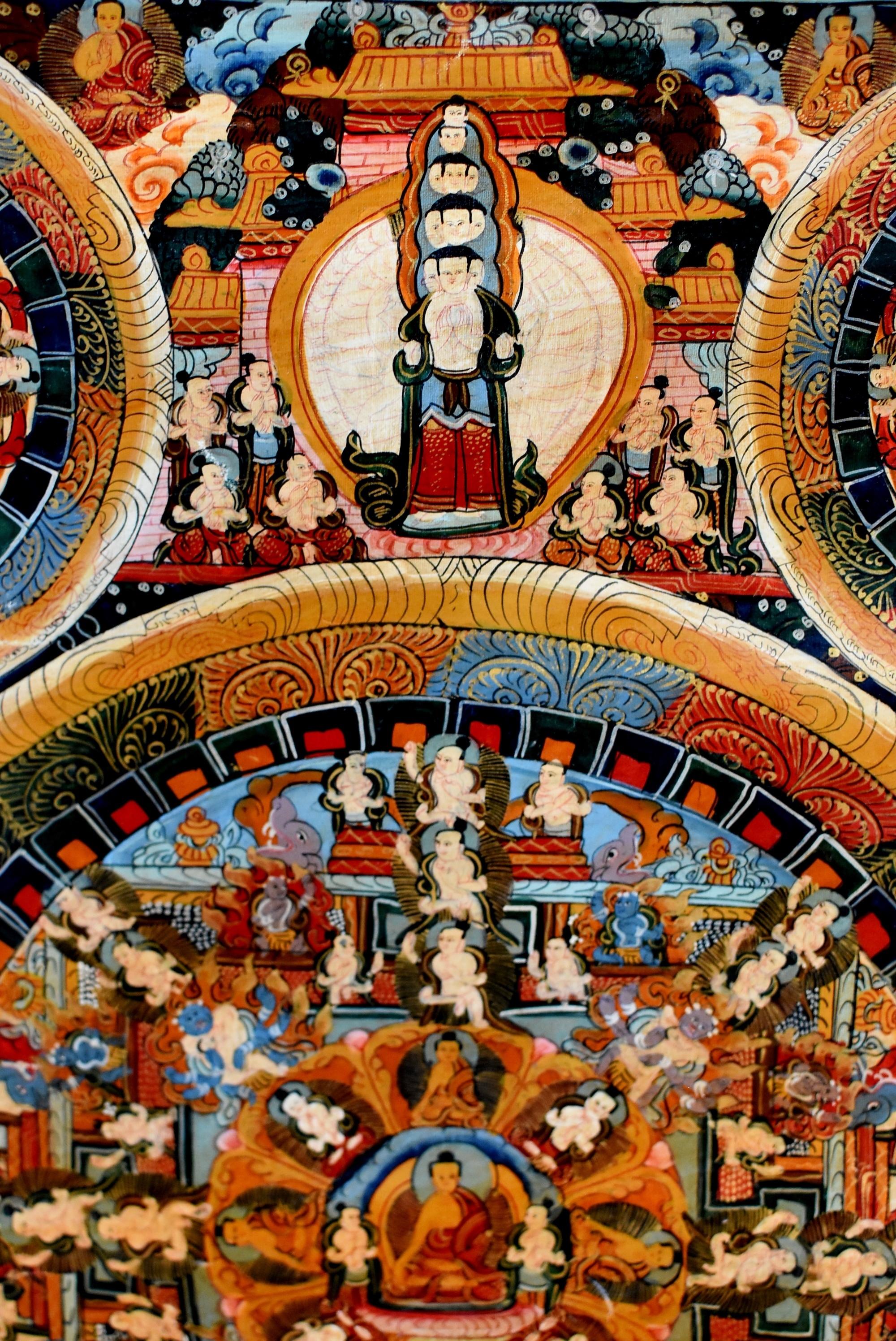 An one of kind rare offering. This large, vintage, hand painted Thangka depicts Buddha's life cycle. The extremely complex painting demonstrates hundreds of Buddha images, from his attainment of enlightenment to many manifestation as saviors, from