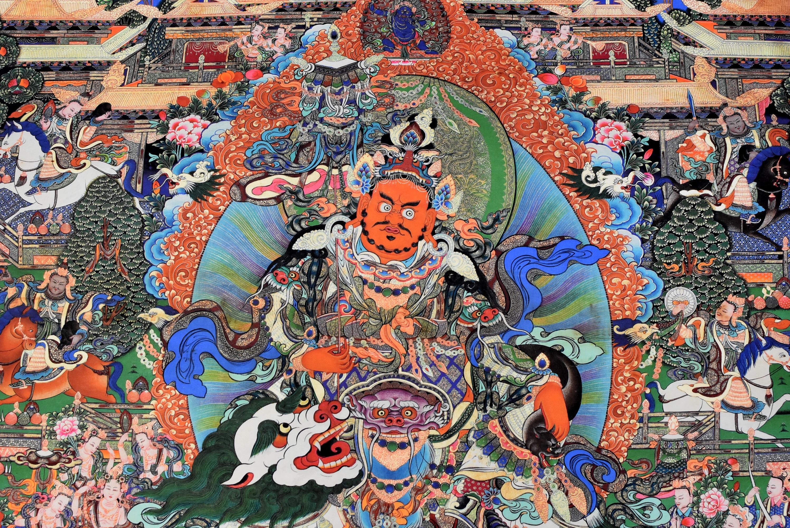 Absolutely stunning Thangka painstakingly painted by Tibetan artists. This piece depicts the protection god Dorje Drolo whose ferocious expression subdues negative and demonic forces. This painting is very full with splendid colors and vivid