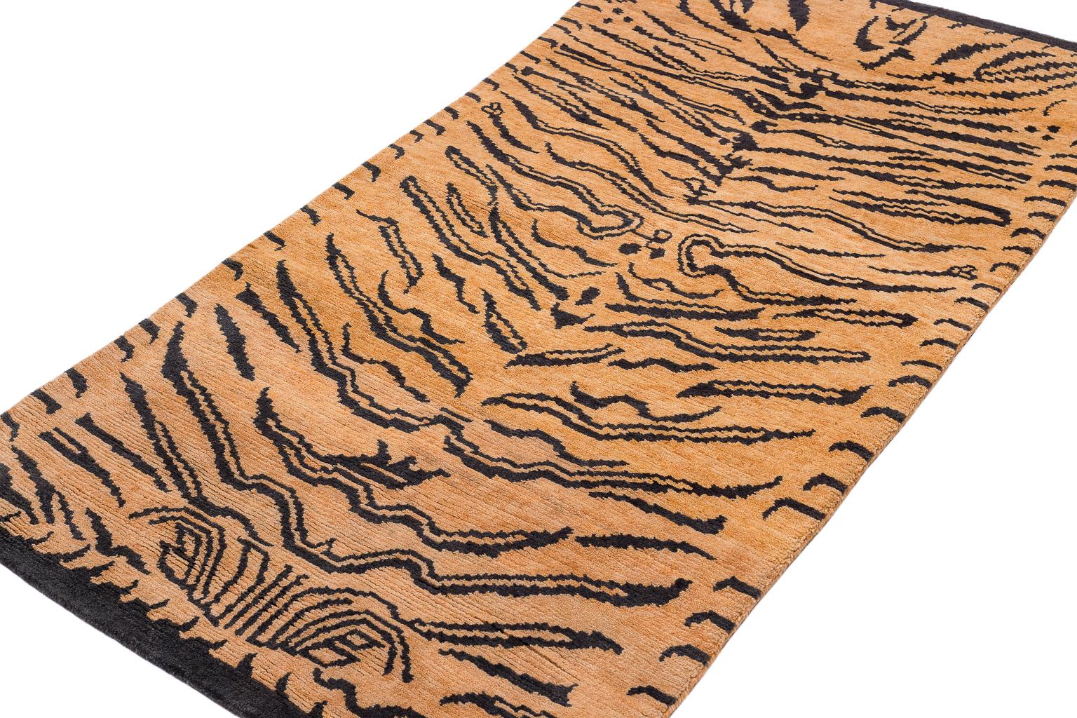This tiger carpet is a fresh take on an original Joseph Carini design. It has a textured weave - a Devi weave, 60 Knot. It is 100 % wool, hand-spun, and handwoven in Nepal. The abstract animal print is bold but not overwhelmingly so. Measures: 3' x