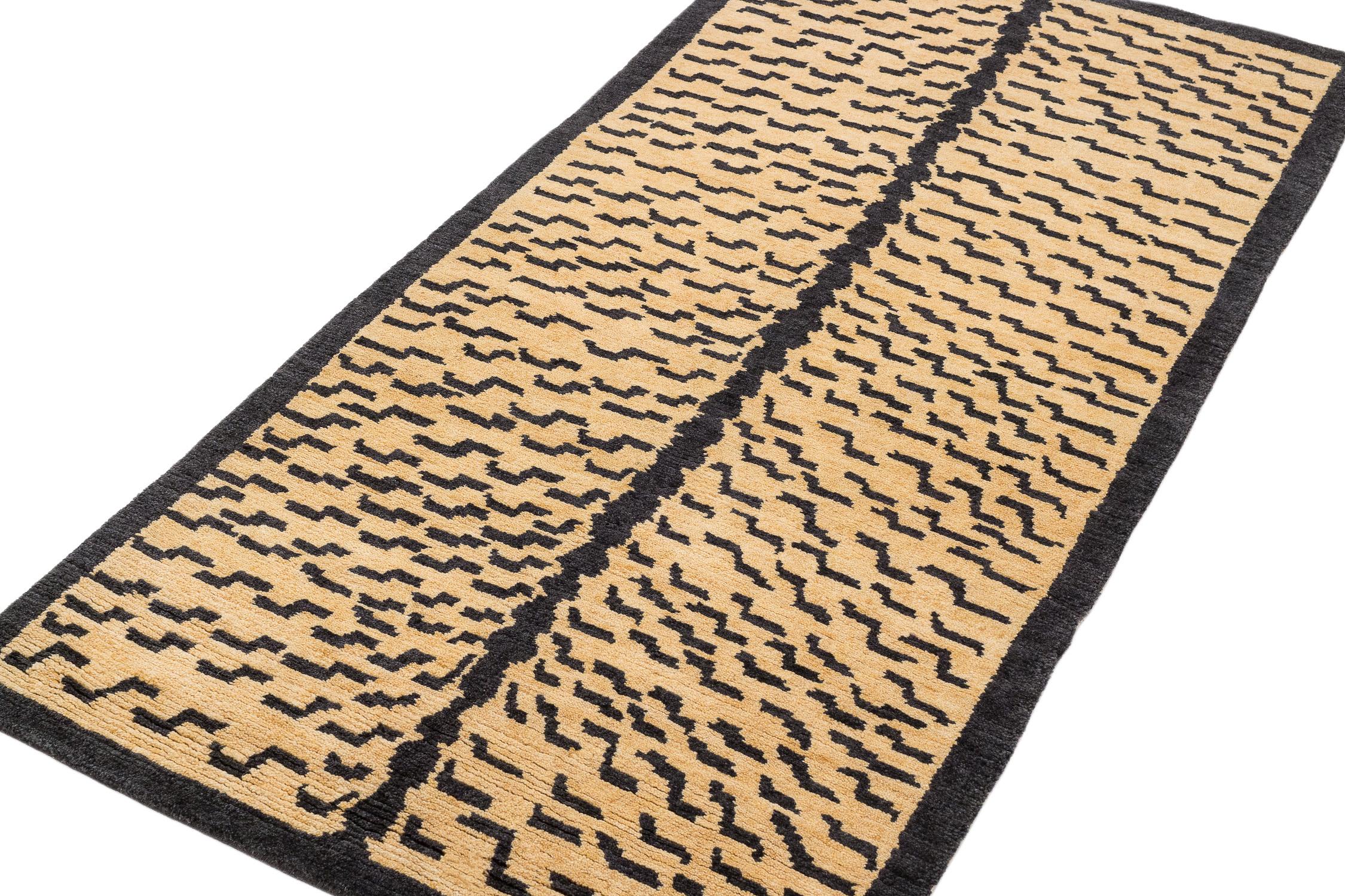This tiger carpet is a fresh take on an original Joseph Carini design. It has a textured weave - a Devi weave, 60 knot. It is 100% wool, hand-spun, and handwoven in Nepal. The abstract animal print is bold but not overwhelmingly so. Measures: 3' x