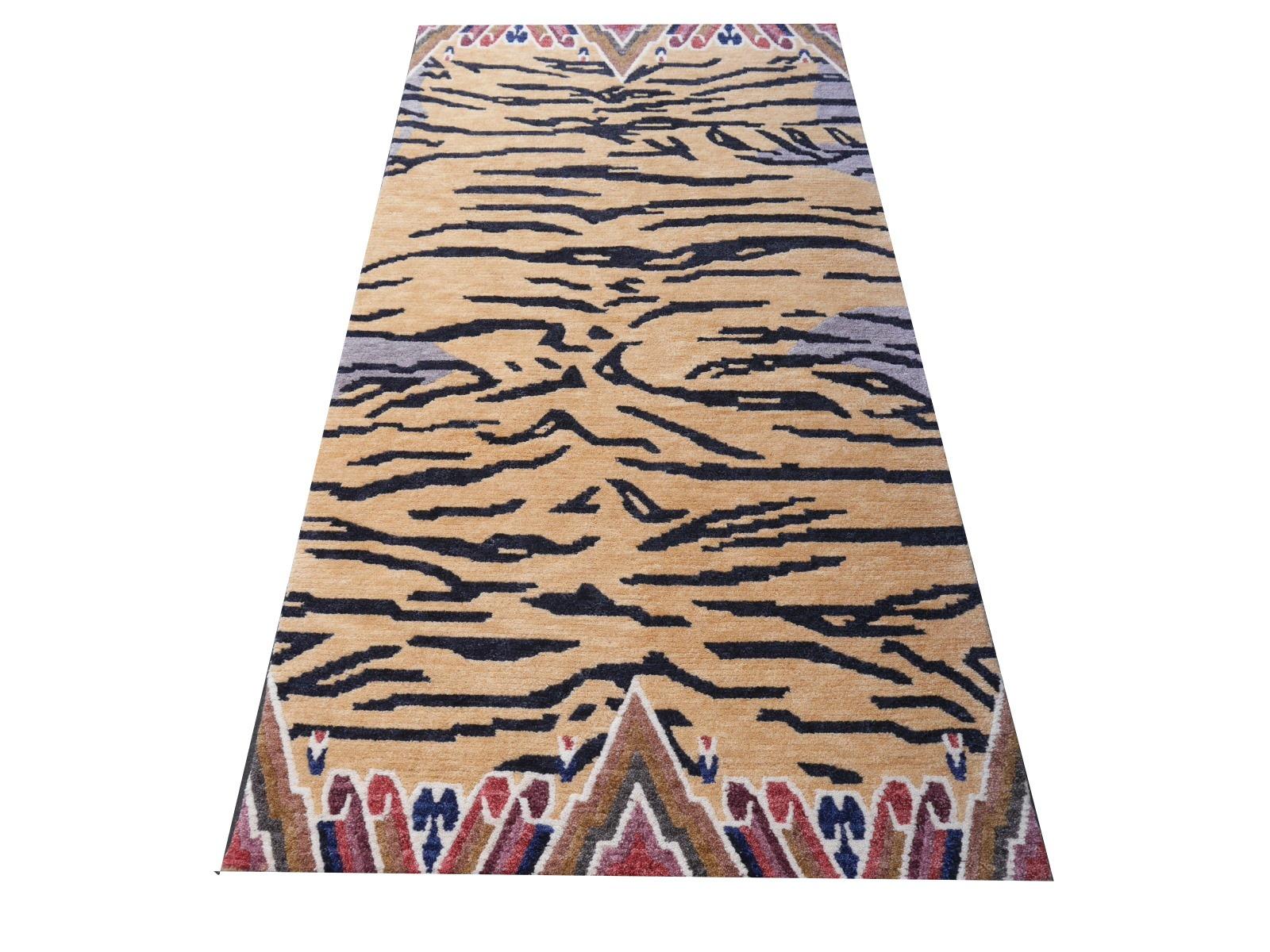 A Tibetan tiger rug, hand knotted in Nepal.

This traditional Tiger rug design is typically found on antique rugs called Khaden. It describes a small sized rug of about 3 x 6 ft that was used in Tibet to decorate columns or seat pad. Often these