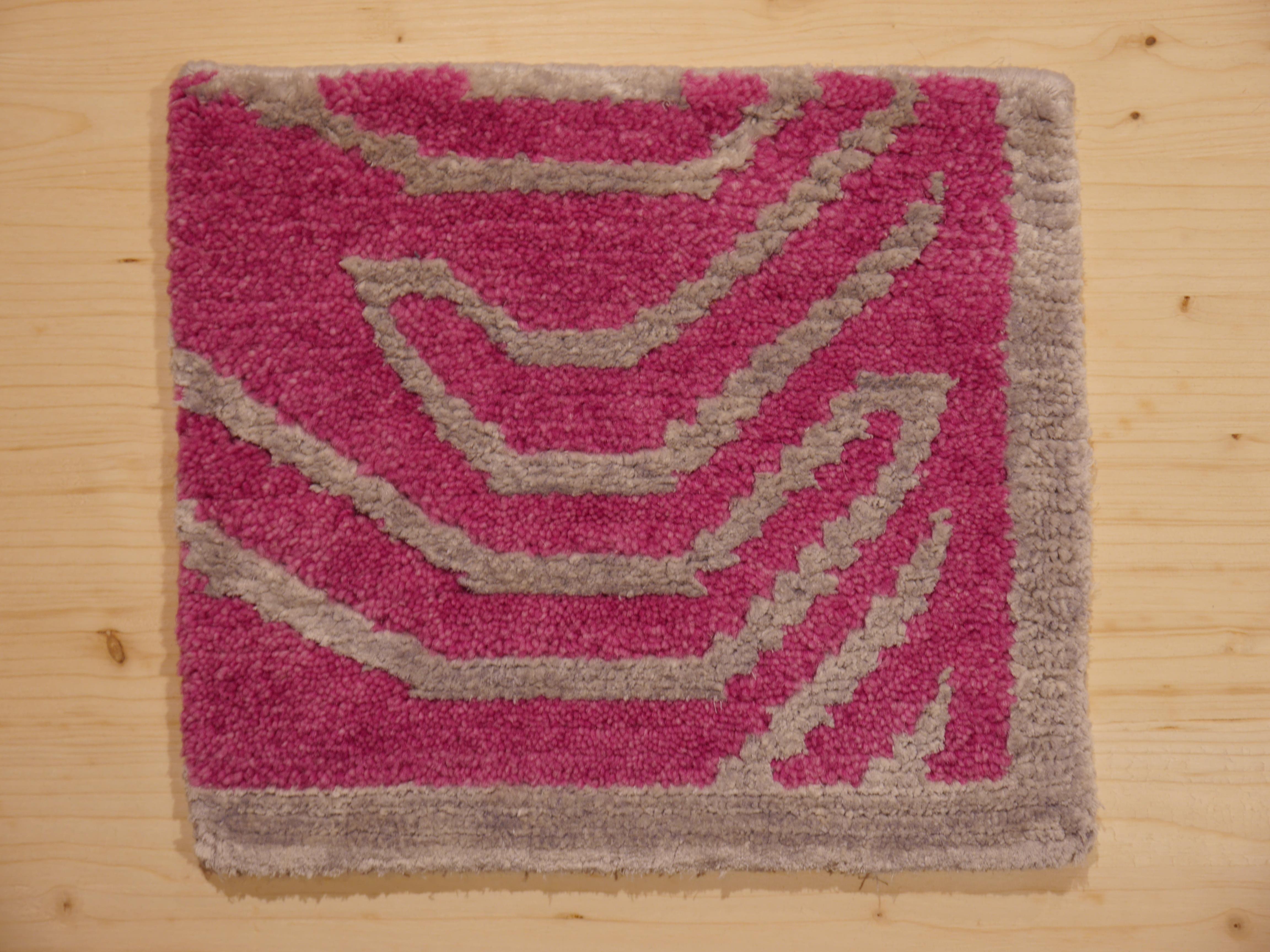Sample Rug for a pink and silver Tibetan Tiger rug, hand knotted in Nepal.

If you would like to order the Pink Tiger rug and you are unsure about the color in your lighting situation at home, please purchase this sample to confirm the colors. 
We