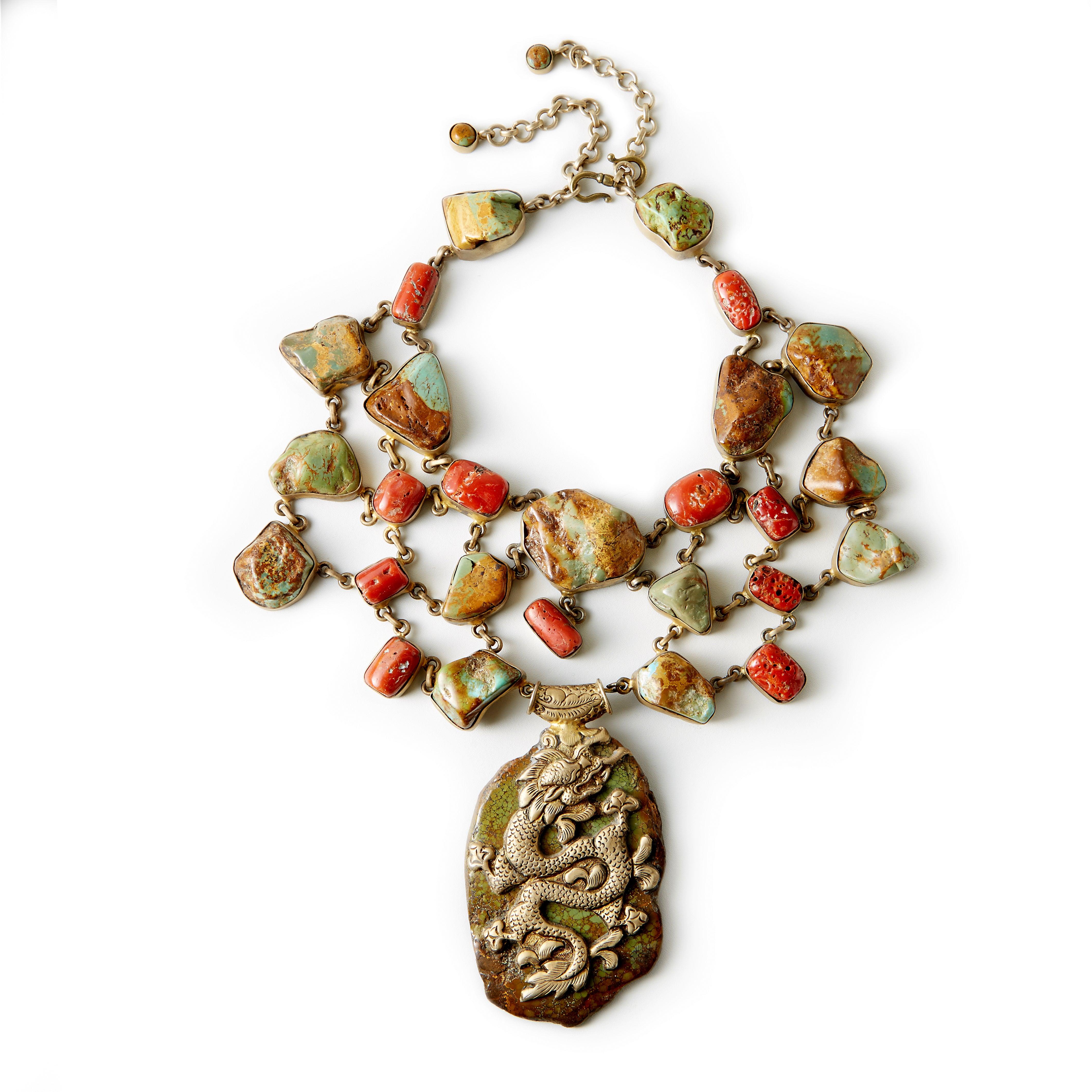 I adore this piece! It is sooo interesting - it really makes a statement! Tibetan Green Turquoise & Coral on a silver-gilt flexible necklace. As large as it is, it is easy to wear. Simply wonderful with jeans or as you can see Melora Hardin wears it