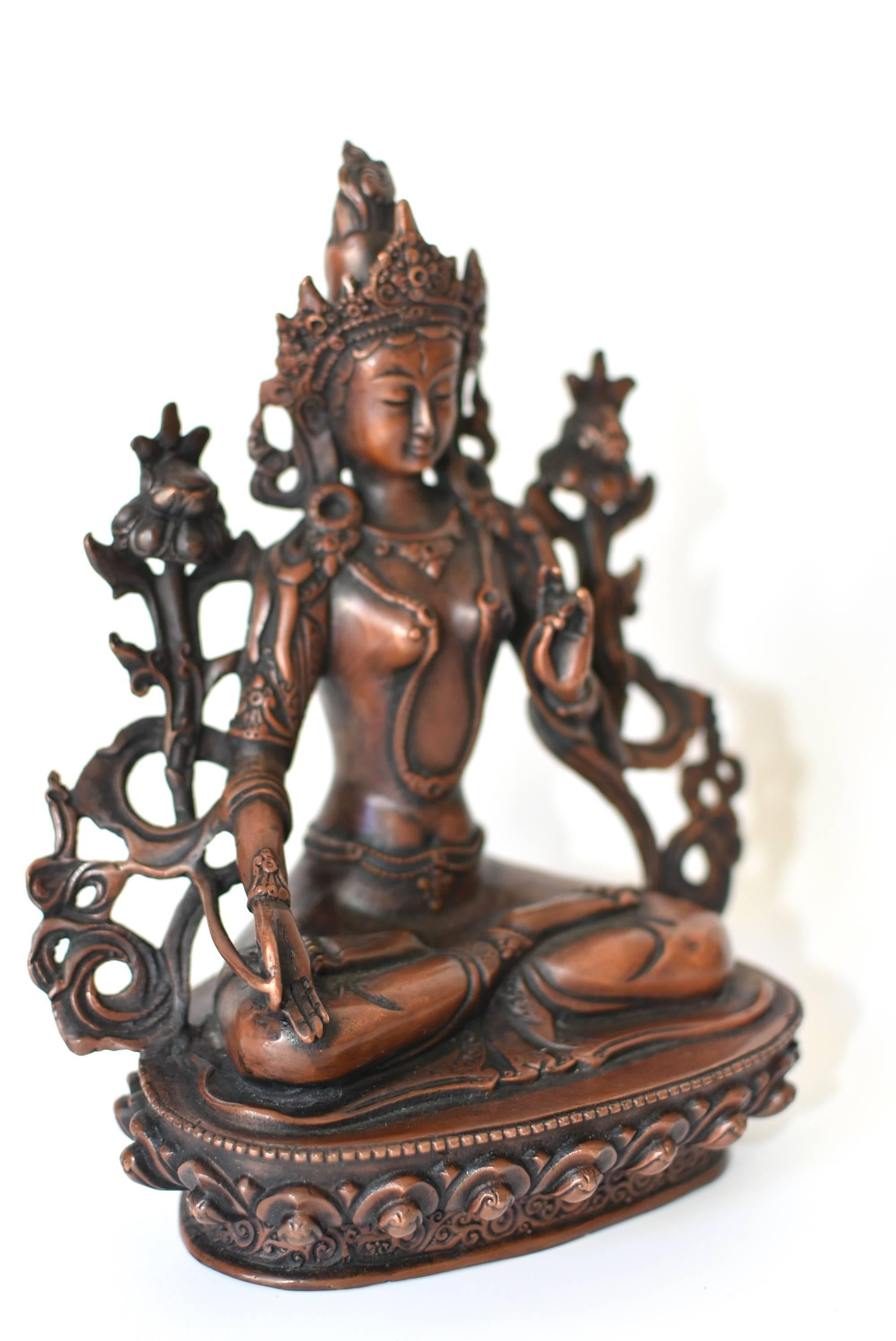 The White Tara, Tibetan Goddess of Great Compassion, is a beloved Bodhisattva who is believed to deliver immediate aid to suffering. This fantastic piece features the White Tara fully adorned with necklaces, cuffs, crown and sashes decorated with