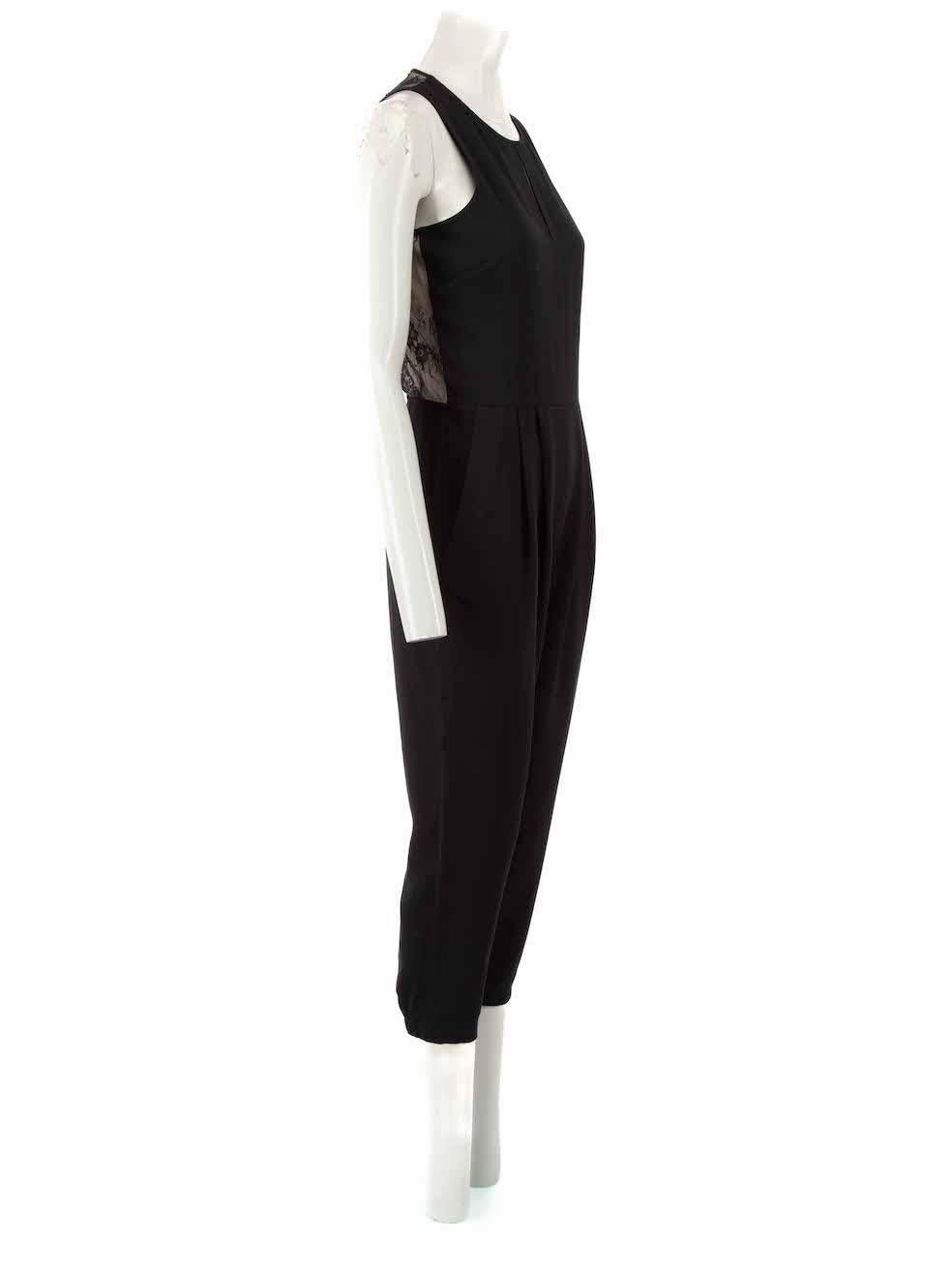 CONDITION is Never worn, with tags. No visible wear to jumpsuit is evident on this new Tibi designer resale item, however there is a warp to the mesh weave at the rear as a manufacturing technicality.
 
 Details
 Black
 Synthetic
 Jumpsuit
