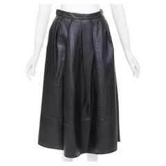 TIBI: gonna midi a trapezio con vita alta, plissettata, in pelle di agnello nera, taglia US0