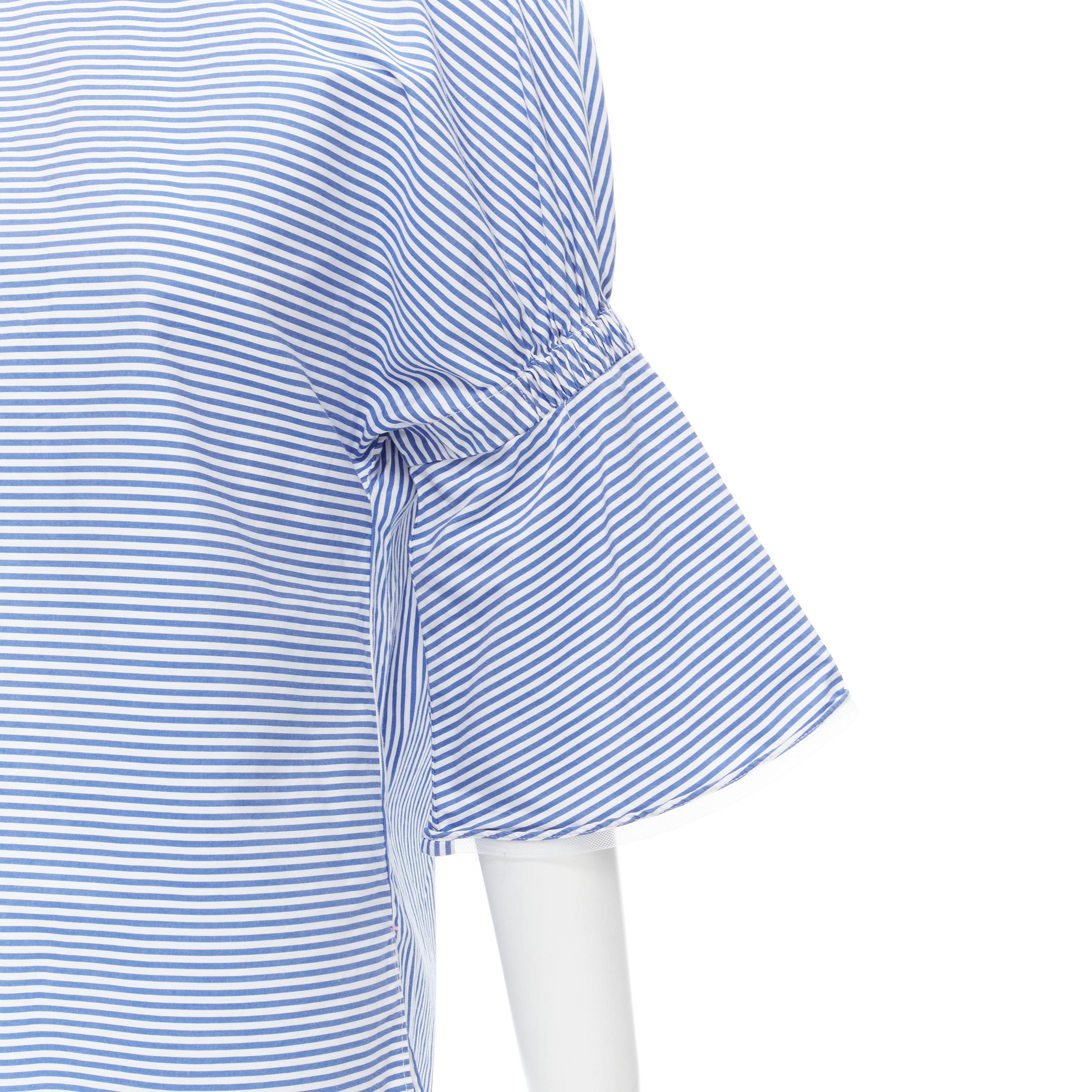 TIBI blue white striped cotton bell sleeves flared back top XS 
Reference: CECU/A00011 
Brand: Tibi 
Material: Cotton 
Color: Blue 
Pattern: Striped 
Closure: Zip 
Extra Detail: White mesh trimmed along sleeves. 
Made in: China 

CONDITION: