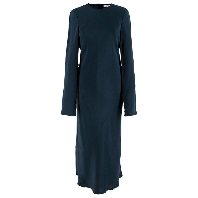 Tibi Dark Blue Midi Silk Dress with Sheer Back  

-Long sleeve minimal classic design 
-Sheer panel to the back
-Beautiful deep blue color 
-Luxurious silk fabrics 
-Completely silk lined 
-Button fastening to the back
-Button fastenings to the