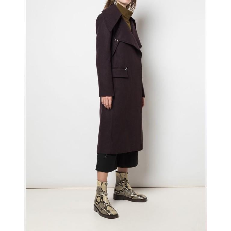 Tibi Double Breasted Oversized Collar Coat 

Plum brown wool blend oversized collar coat
Wrap style front
Side flap pockets
Wide lapel
Eyelets and side straps
Silver-tone hardware/Ring detailing

Measurements are taken laying flat, seam to seam.