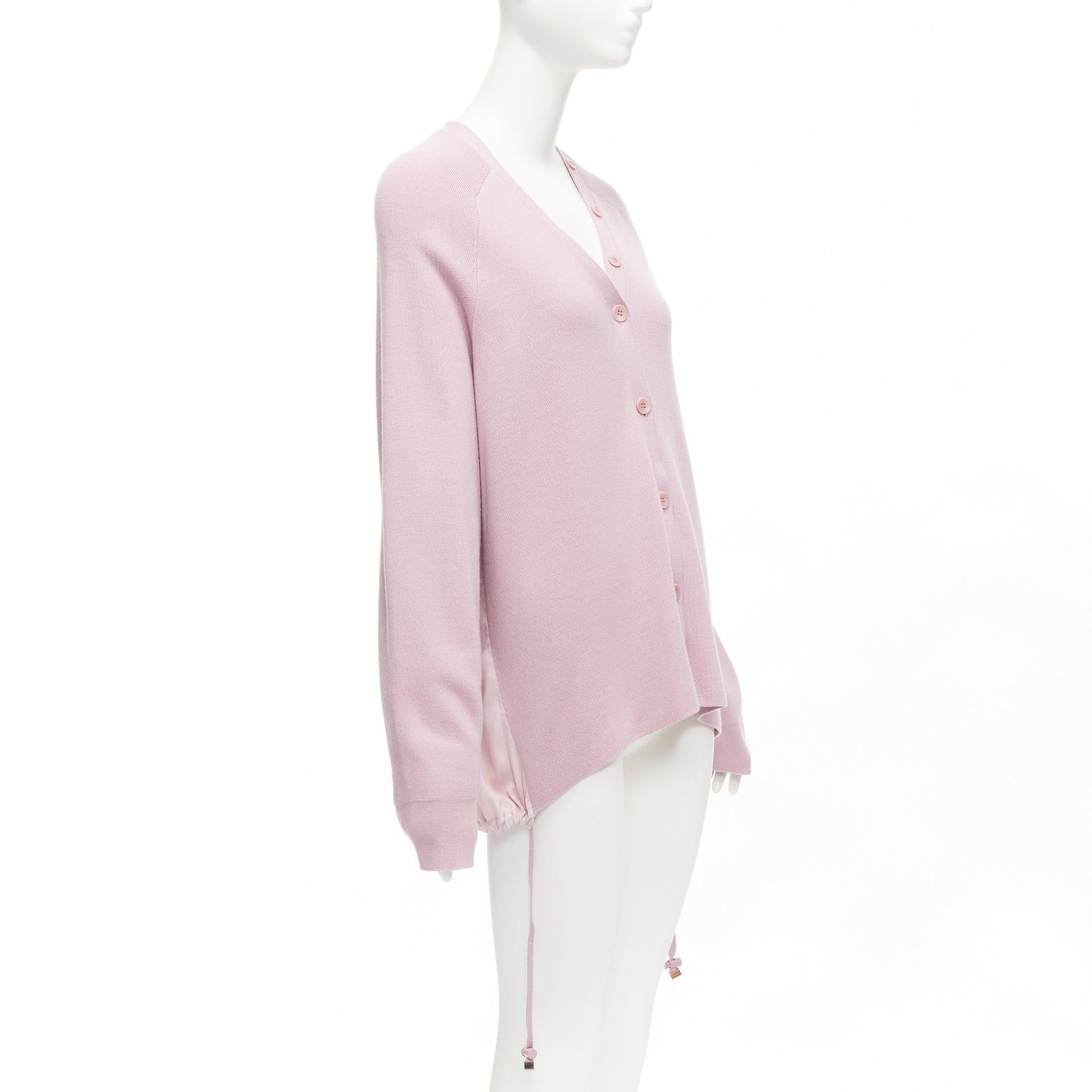 TIBI lilac purple merino wool silk contrast back raglan cardigan XS
Reference: KYCG/A00017
Brand: Tibi
Material: Merino Wool, Silk
Color: Purple
Pattern: Solid
Closure: Button
Extra Details: Drawstring details at sides.
Made in: