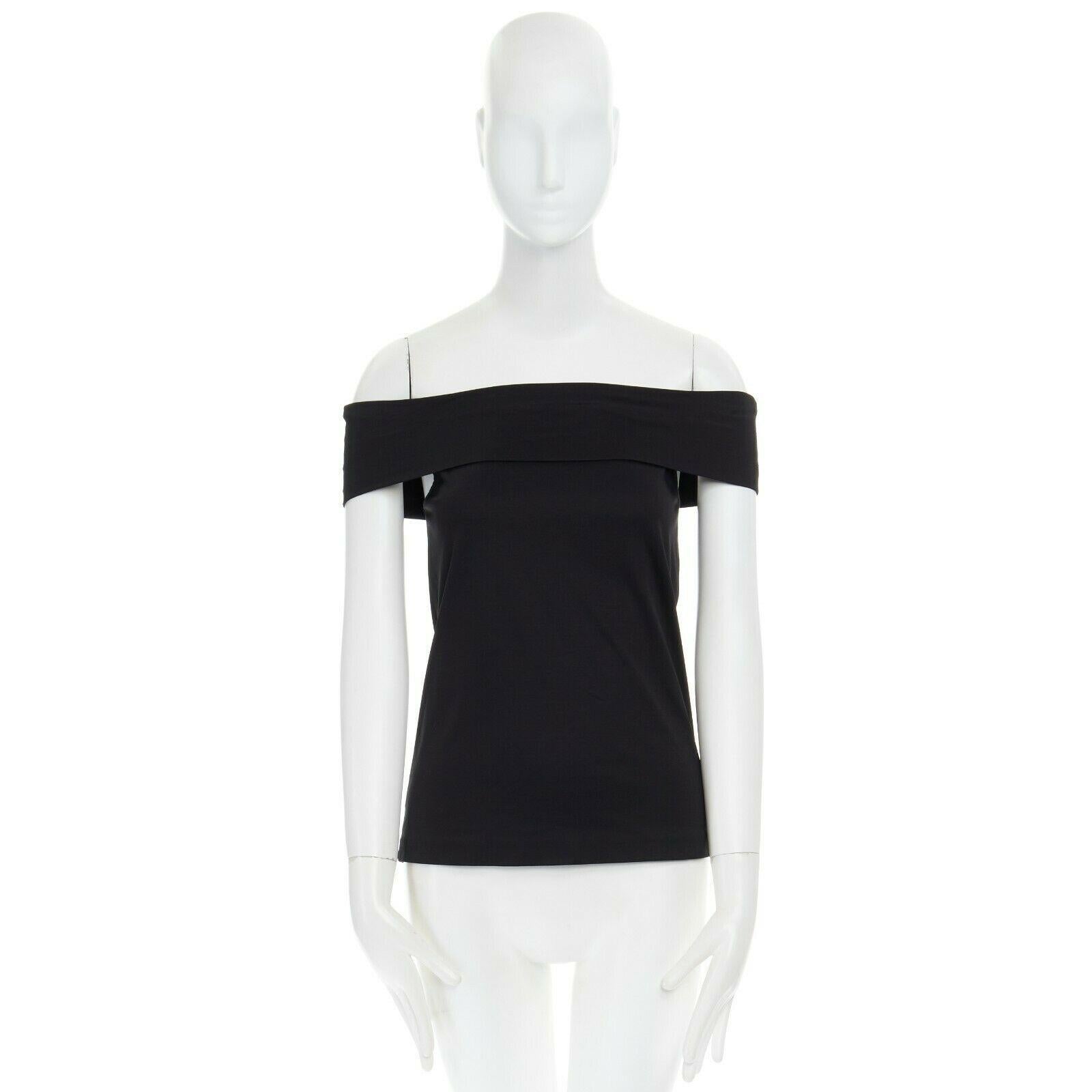 TIBI New York black off shoulder stretch cotton top US00 XS

TIBI New York
100% cotton. 
Black. 
Off shoulder. 
Stretch fit. 
Made in China.

CONDITION:
Condition: Very good, this item was pre-owned and is in very good condition.

SIZING:
Designer