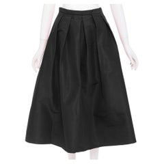 Falda midi de talle alto, corte en A y pliegues estructurados en la parte delantera, de tafetán de seda de TIBI, talla US2 S
