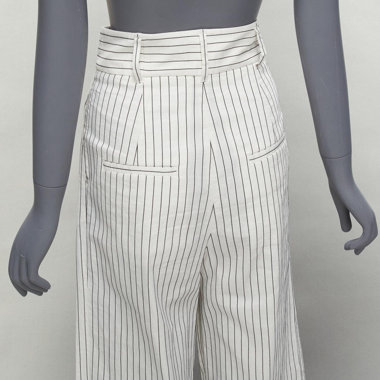 TIBI white black pinstriped linen blend pleated front wide leg cropped pants US0 XS
Reference: SNKO/A00409
Brand: Tibi
Material: Linen, Blend
Color: White, Black
Pattern: Pinstriped
Closure: Zip Fly
Lining: White Fabric
Extra Details: 2 pockets at