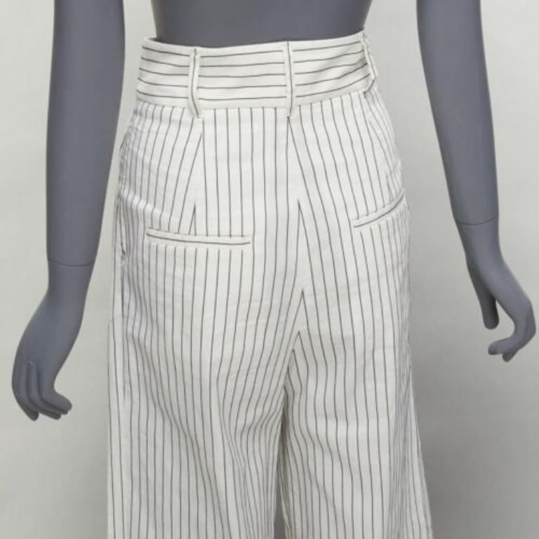 TIBI white black pinstriped linen pleated front wide leg cropped pants US0 XS
Reference: SNKO/A00409
Brand: Tibi
Material: Linen, Blend
Color: White, Black
Pattern: Pinstriped
Closure: Zip Fly
Lining: White Fabric
Extra Details: 2 pockets at