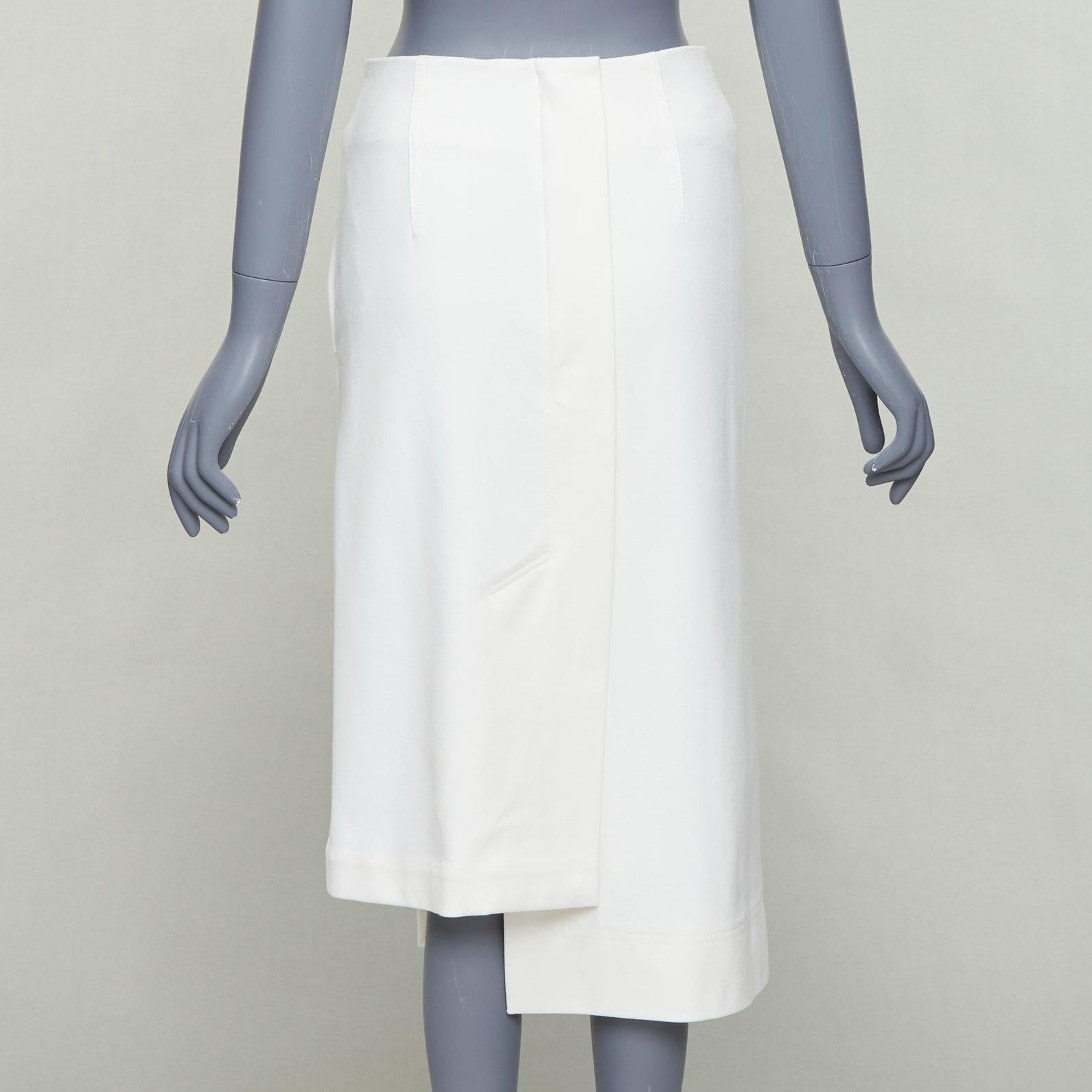 TIBI asymmetrischer, abgeschrägter Bleistiftrock mit weißen Strukturknöpfen, US0 XS Damen im Angebot