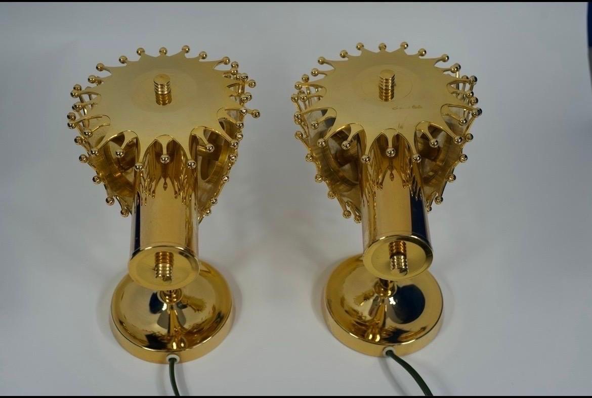 Pair of brass sconces by Tibro Sweden, Brass frame . 1970
Single socket hidden in the frame surrounded by three round polished brass plates.

Rewired for the US.


 