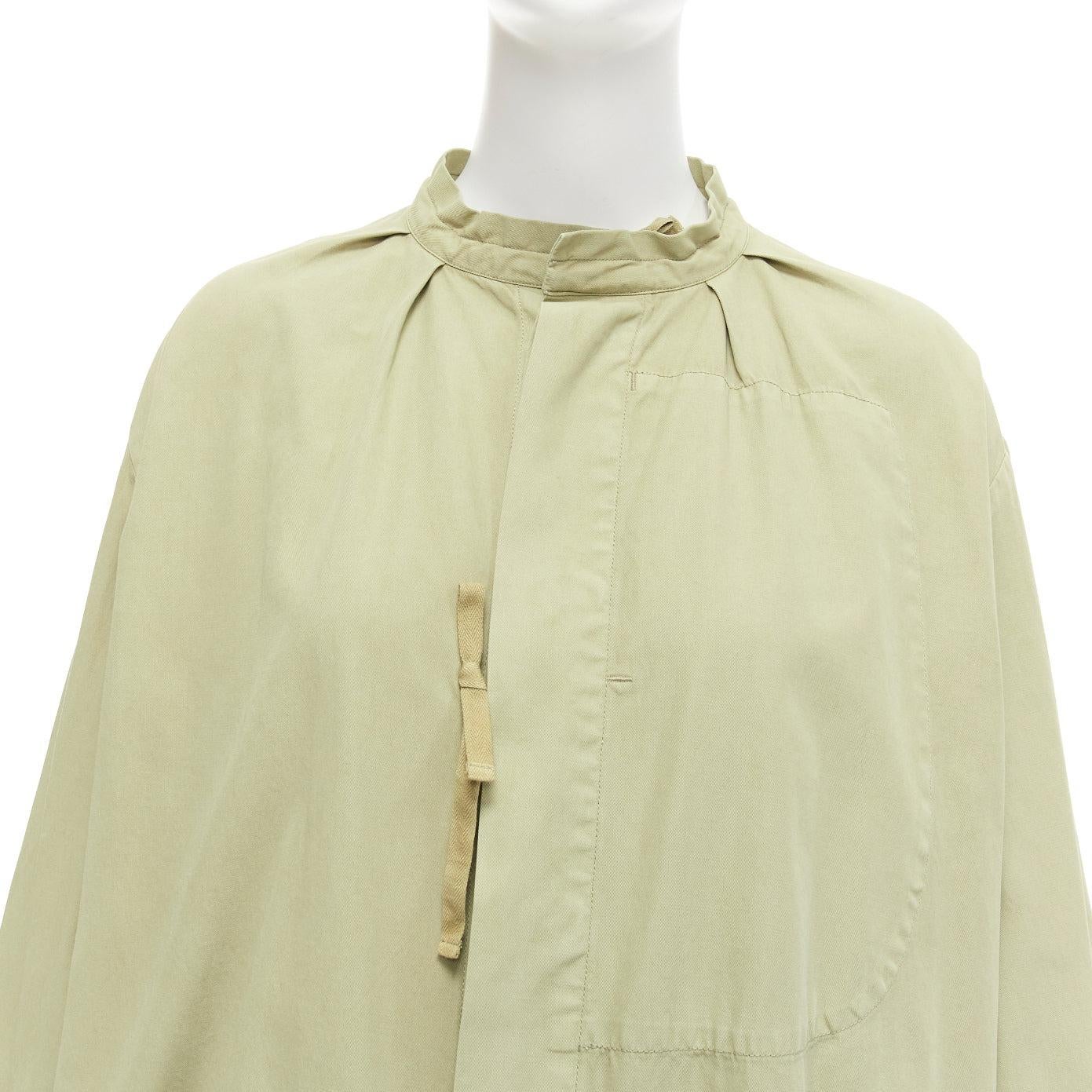 TICCA washed green 100% cotton tie collar centre parka jacket
Reference: JACG/A00128
Brand: Ticca
Material: Cotton
Color: Green
Pattern: Solid
Closure: Self Tie
Extra Details: Hidden buttons with self tie straps.
Made in: