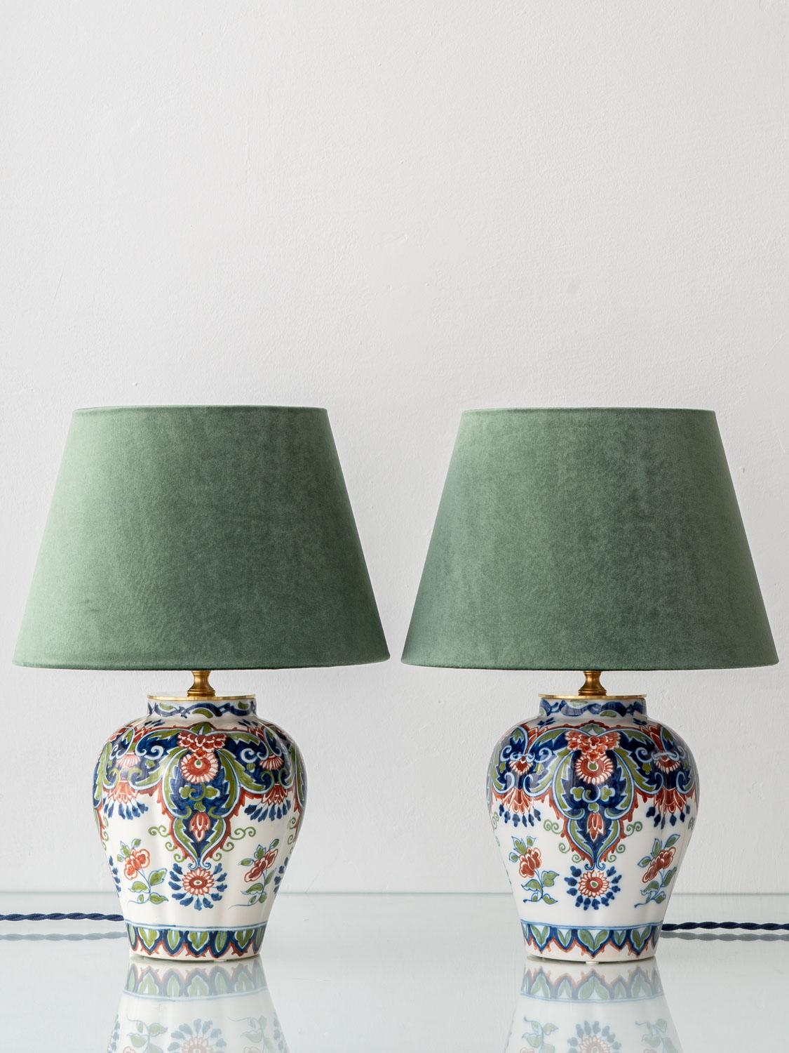 Exquisitely handcrafted by Amitābha Studio in Amsterdam from a pair of vintage Royal Tichelaar Makkum vases (circa 1940–1960), this one-of-a-kind set of table lamps celebrates the enduring beauty of Dutch Delftware with a Chinoiserie twist. The
