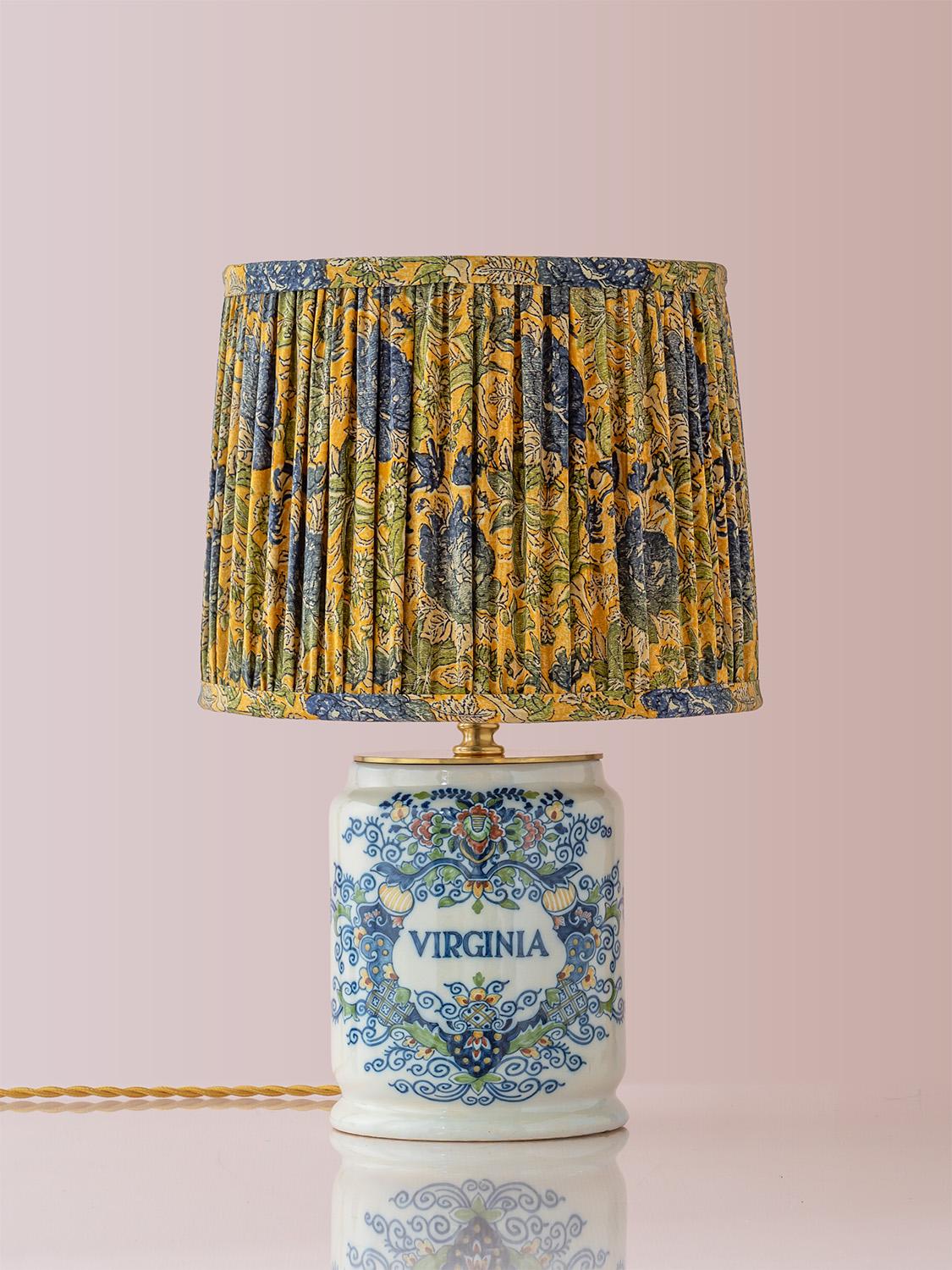 Exquisitely handcrafted by Amitābha Studio in Amsterdam, Virginia is a one-of-a-kind table lamp made from a rare vintage Royal Tichelaar Makkum Delft tobacco jar, produced between 1948 and 1979. Historically used to store premium Virginia tobacco,
