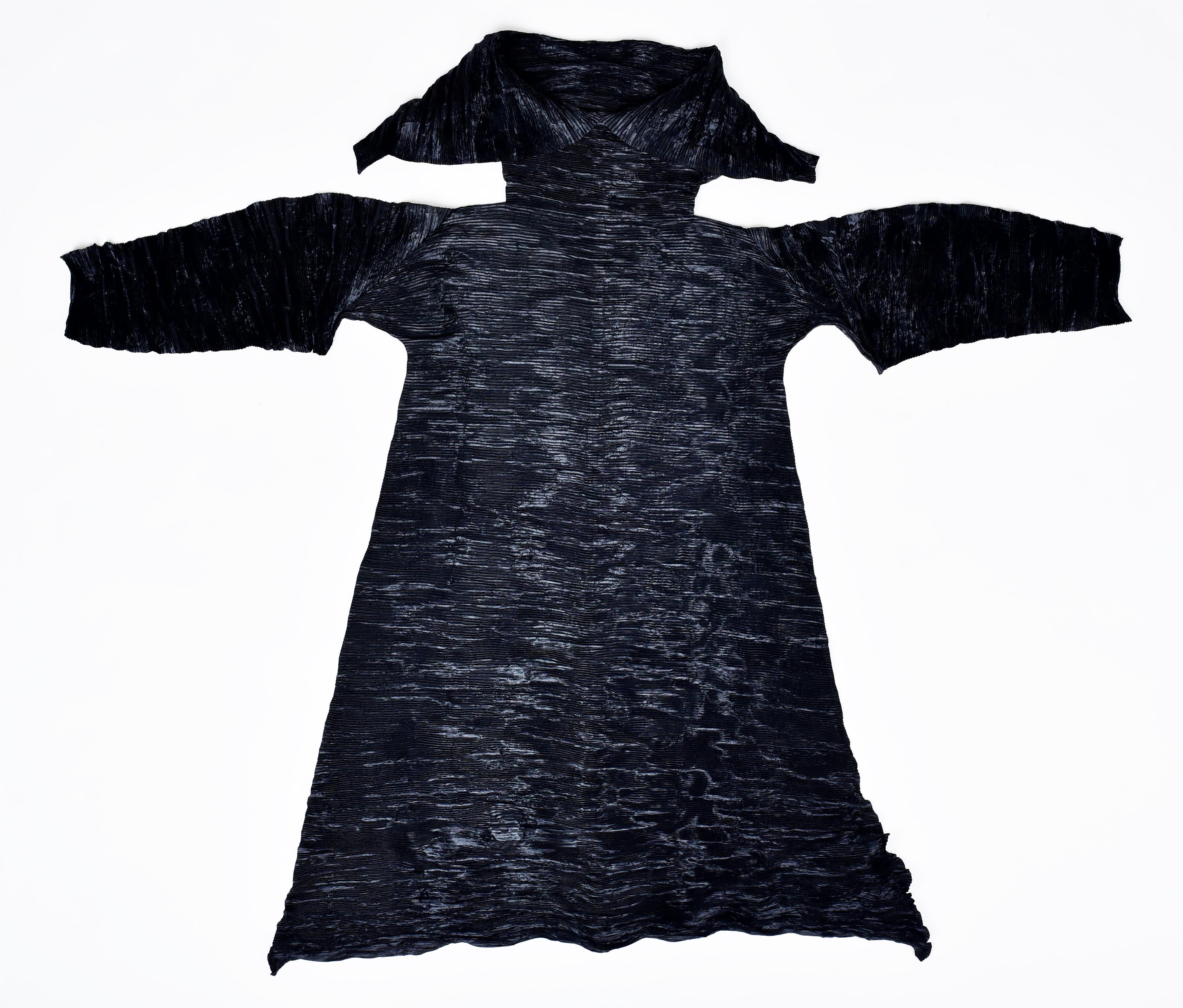 Collection Fall 1992-1993
Japan

A Dramatic Tidal Wave dress in anthracyte black polyester by Issey Miyaké from the 1992/1993 Fall Collection. Chasuble dress with long sleeves and large collar in finely pleated and pressed polyester, allowing twists