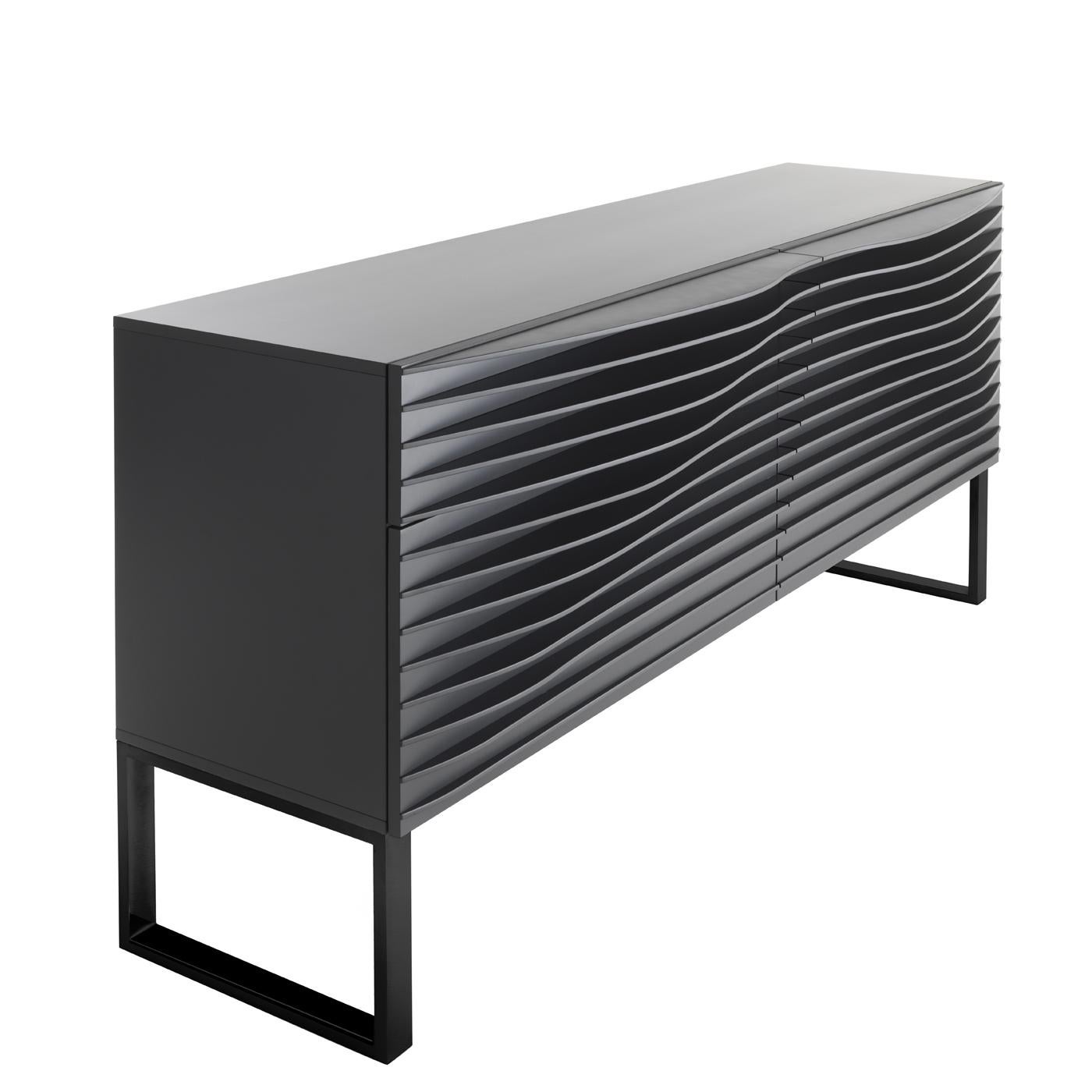 This sideboard by Karim Rashid exquisitely reflects the dynamic and modern functional style of the designer. Boasting a truly eye-catching silhouette, the four drawers have unique front panels made of evenly-spaced, horizontal thin sheets of MDF.