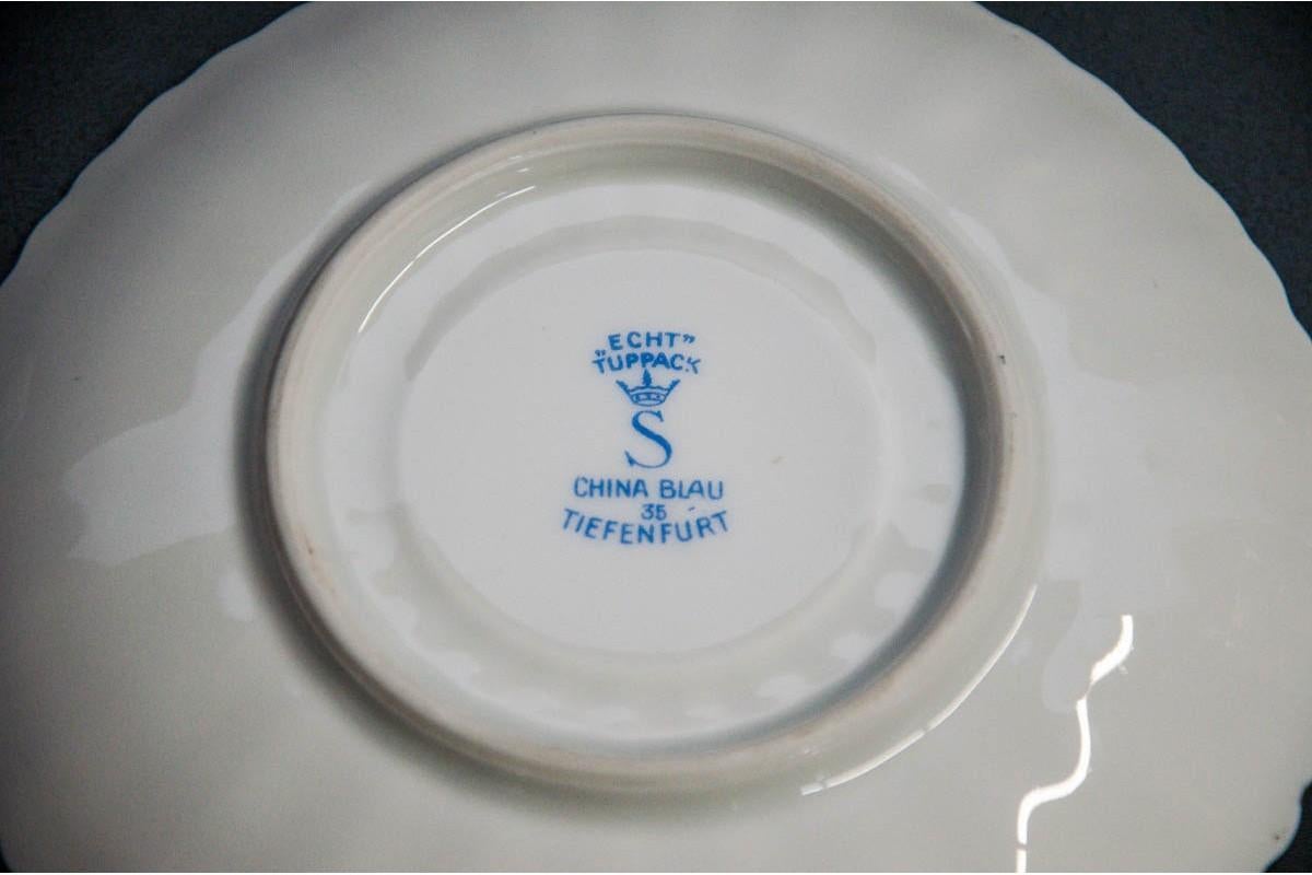 Tiefenfurt cup and saucer.

Dimensions:

Cup: Height 5 cm, diameter 9 cm

Stand: sr. 15 cm.
