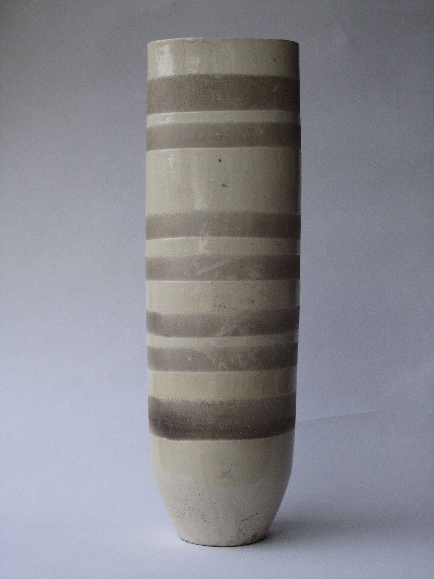 Genesis V is a unique ceramic sculpture by contemporary artist Tien Wen, dimensions are 50 × 15 × 15 cm (19.7 × 5.9 × 5.9 in). 
The sculpture is signed and comes with a certificate of authenticity. 

This abstract and minimalist piece captivates