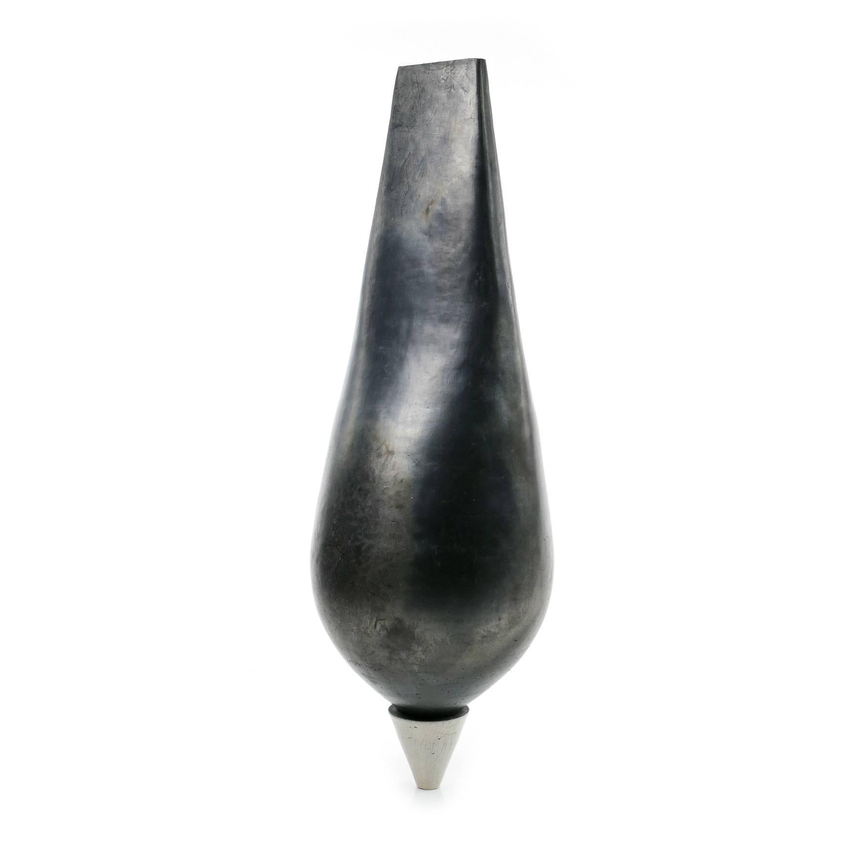 Naos is a unique ceramic sculpture by contemporary artist Tien Wen, dimensions are 68 × 25 × 23 cm (26.8 × 9.8 × 9.1 in). 
The sculpture is signed and comes with a certificate of authenticity.

The sculpture has a metallic quality that is similar to