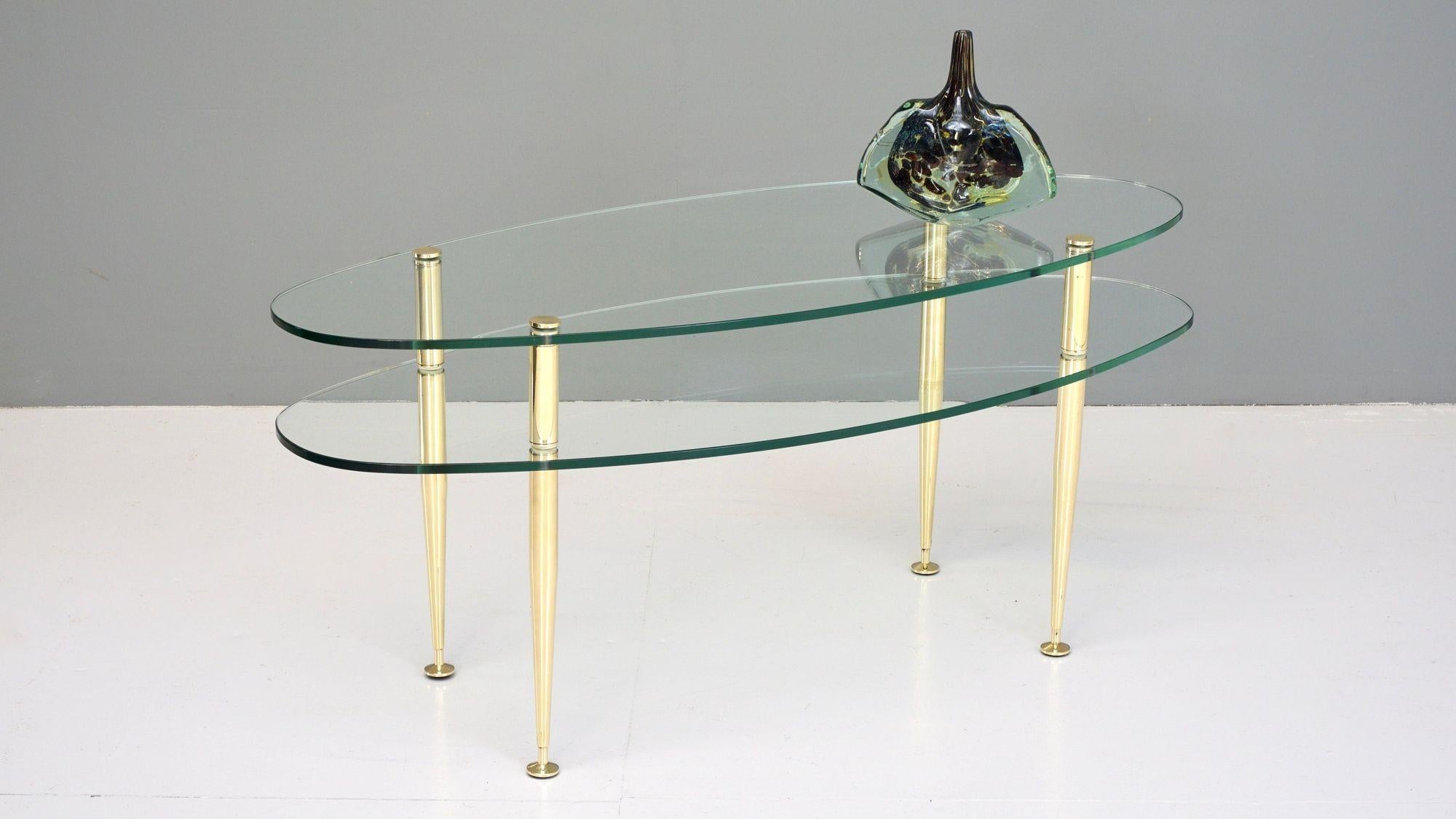 French double tiered coffee table on brass supports.

France, Circa 1950

H 46.5cm x W 104cm x D 44.5cm teir height 34cm

Please be in contact if you require anymore information about our products.

IMPORTANT

Please be in contact before making a