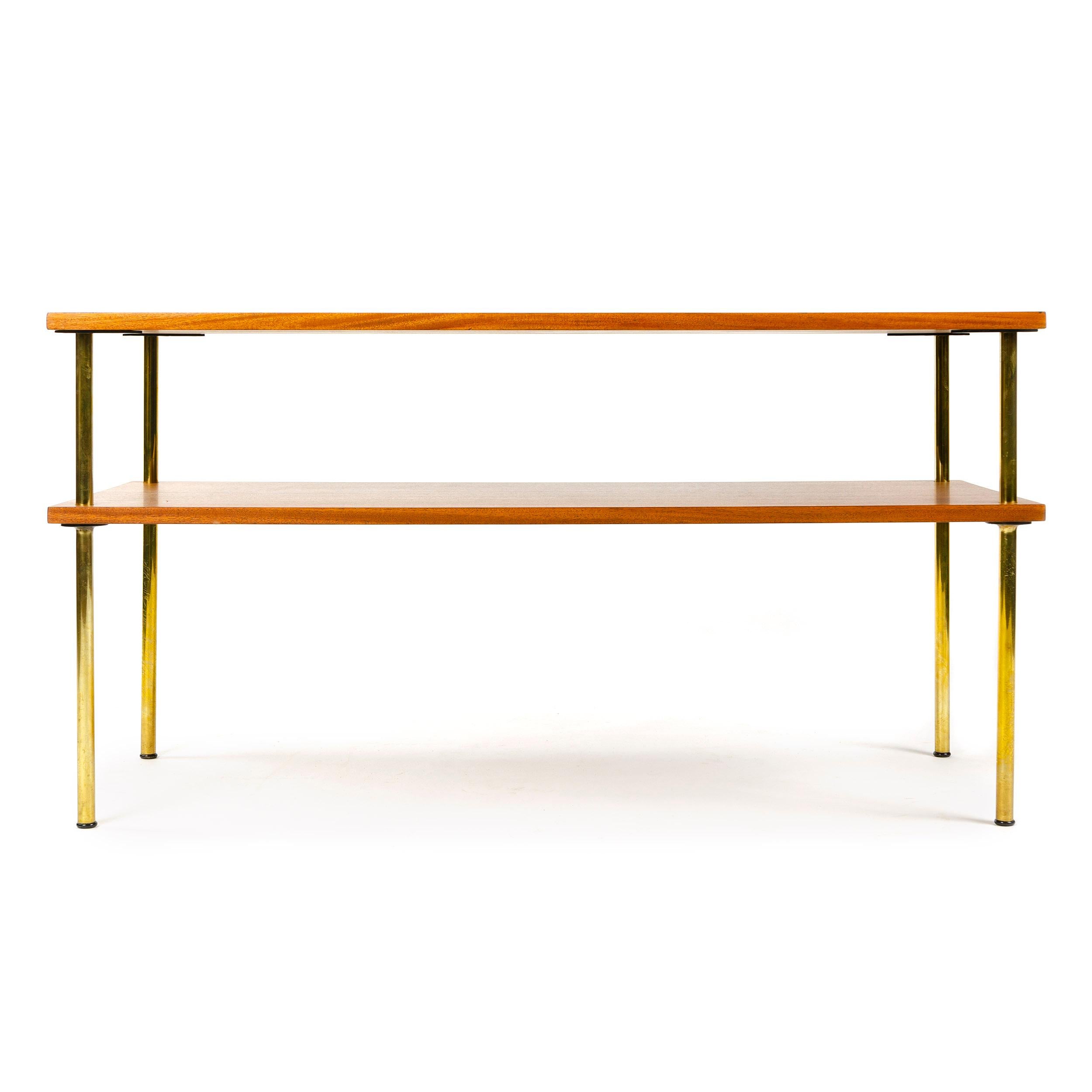 A Mid-Century Modern walnut console table / coffee table designed by Harvey Probber with a single shelf and brass through tenon legs. Made in the USA, circa 1960s.