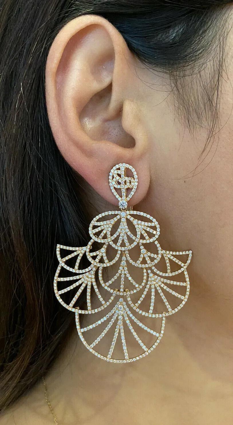 Tiered Diamond Chandelier Earrings with 9.50 carats total weight in 18k Rose Gold

Large Diamond Chandelier Earrings features Tiered layers of Fan-shaped sections encrusted with 9.50 carats of Natural Round Brilliant Diamonds set in 18k Rose