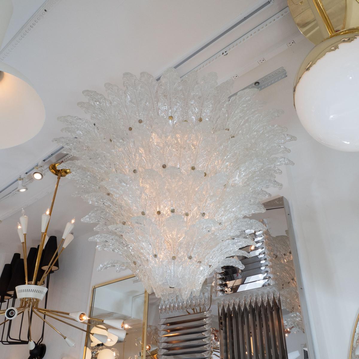 Tiered frosted glass leaf chandelier with brass finial details in the style of Barovier.