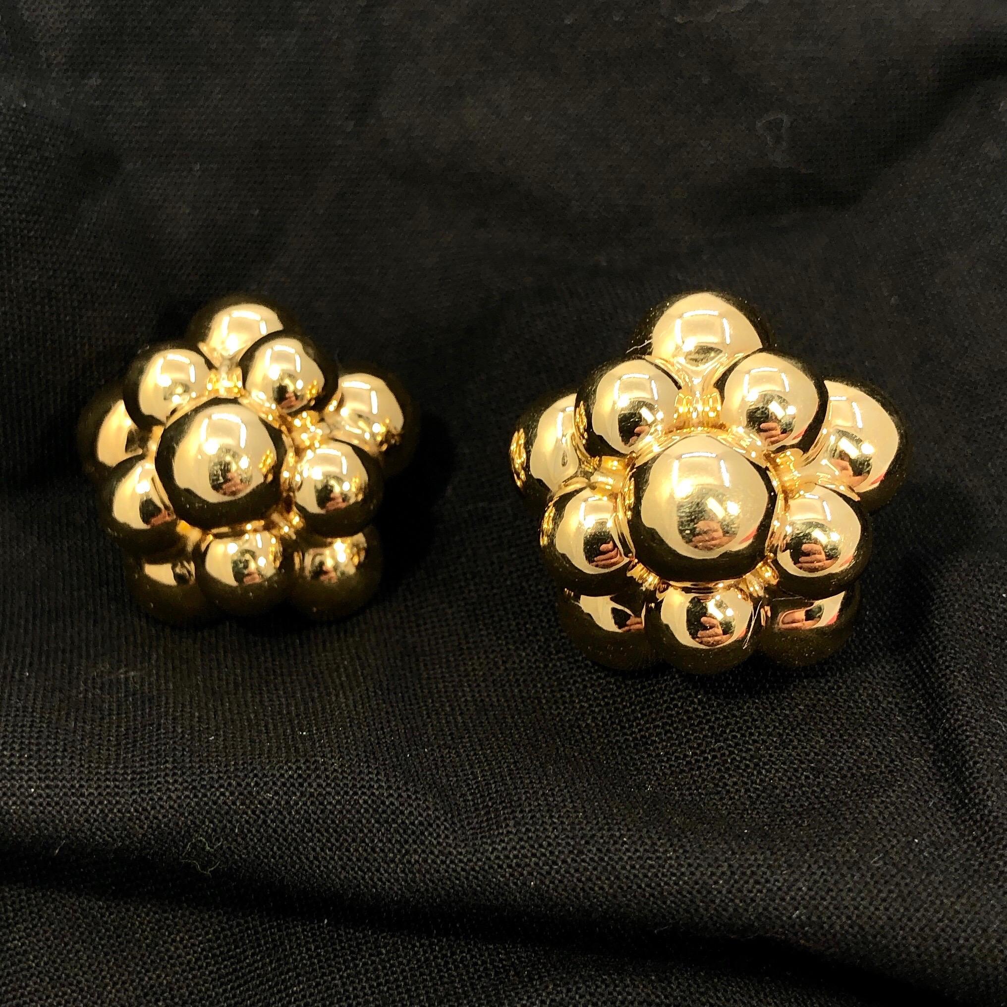 These wonderful, vintage Italian gold ball earrings are expertly crafted in 14k yellow gold. With a measurement of 1 1/8 inch by 1 inch, they have an unmistakable presence. The tiered gold ball design is very stylish and well manufactured.  They are