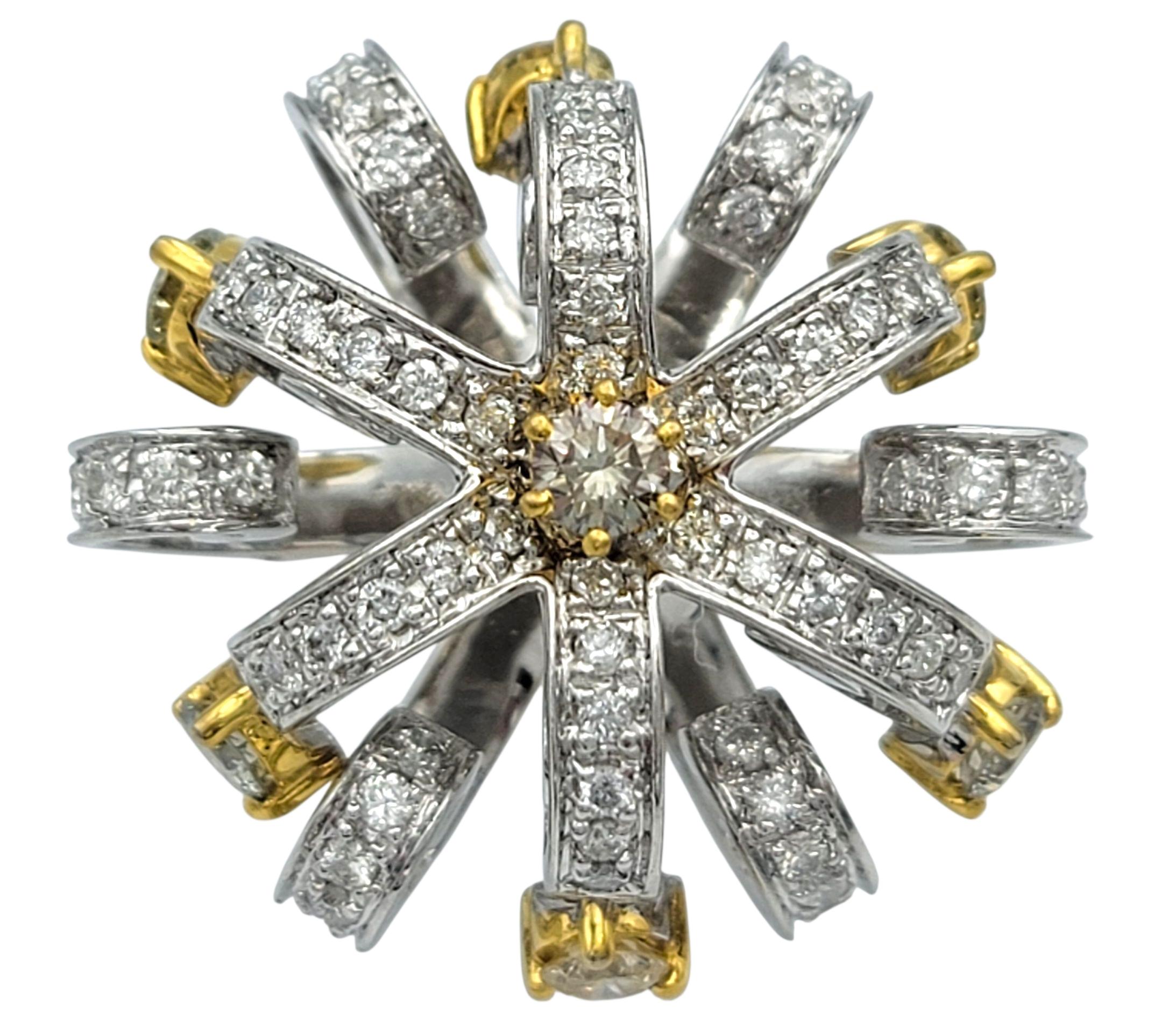 Bursting with expressive charm, this sculptural cocktail ring dazzles in the shape of a dramatic floral bloom. Radiating from the center are layered petals composed entirely of round brilliant cut diamonds, each one meticulously arranged to catch