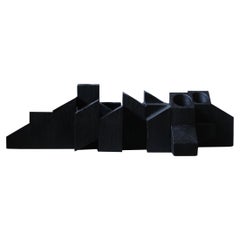 Tiered Structure Black Skyline Candle Light in Iroko Wood by Arno Declercq