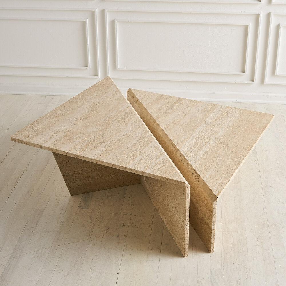 A two-tiered travertine coffee table with excellent versatility. Sourced in Europe. 

Dimensions: Pushed together, the pair of travertine tables measure 38” x 40” and 11.5” H and 16” H

Condition: Minor age appropriate wear to the corner of the