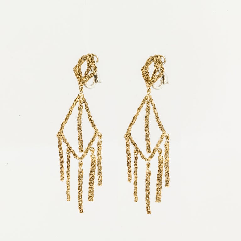 18K yellow gold earrings which are tiered with rope-like dangles that have free movement.  Measure 3 inches long and 1 inch wide.  