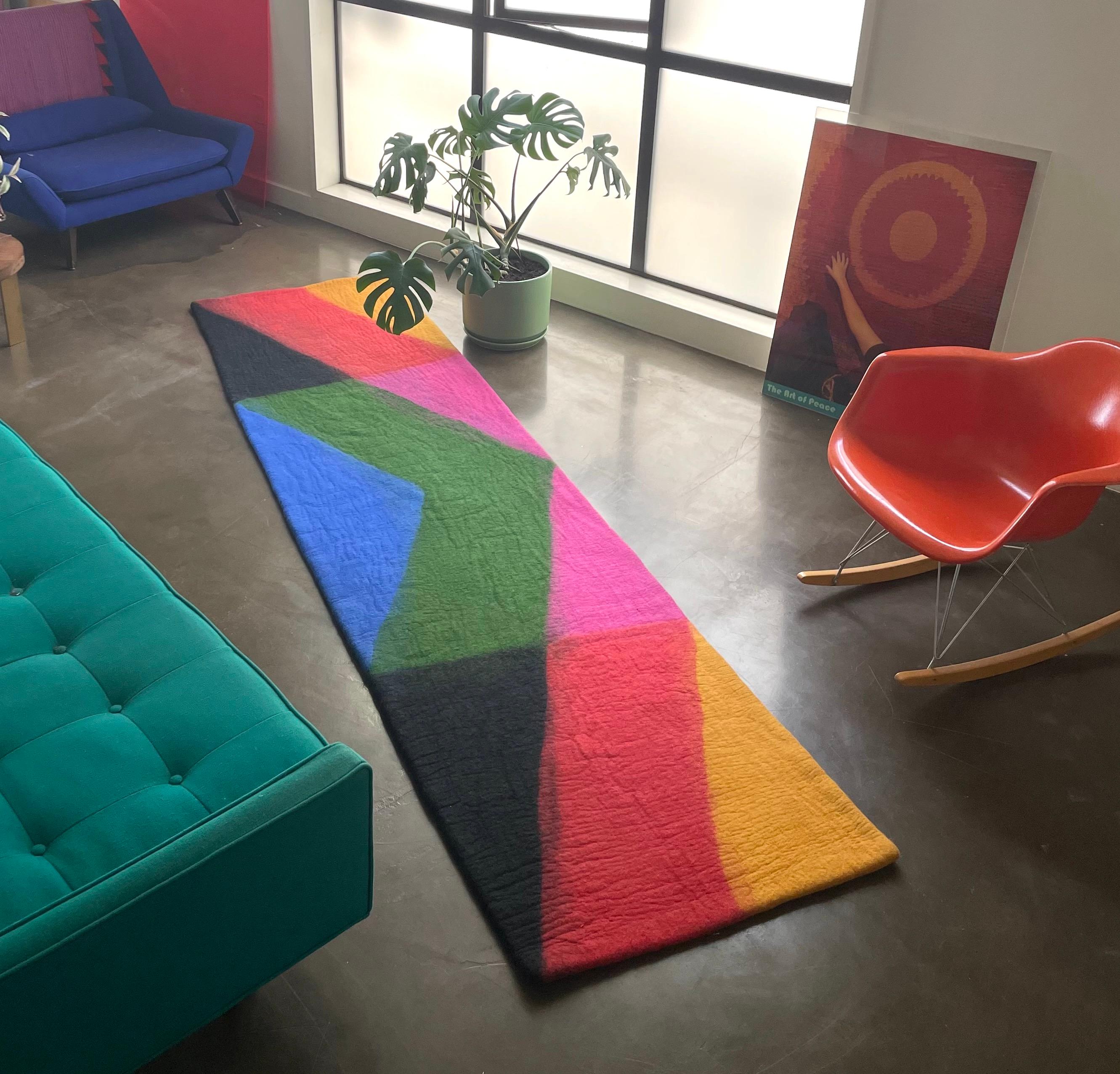 This rug is extremely unique. The history of wool felt rugs began with nomadic tribes in the Central Asian Steppes. I have been producing and designing this extremely rare form of rug making since 2002 in Iran, Turkey and now, Nepal. The price is