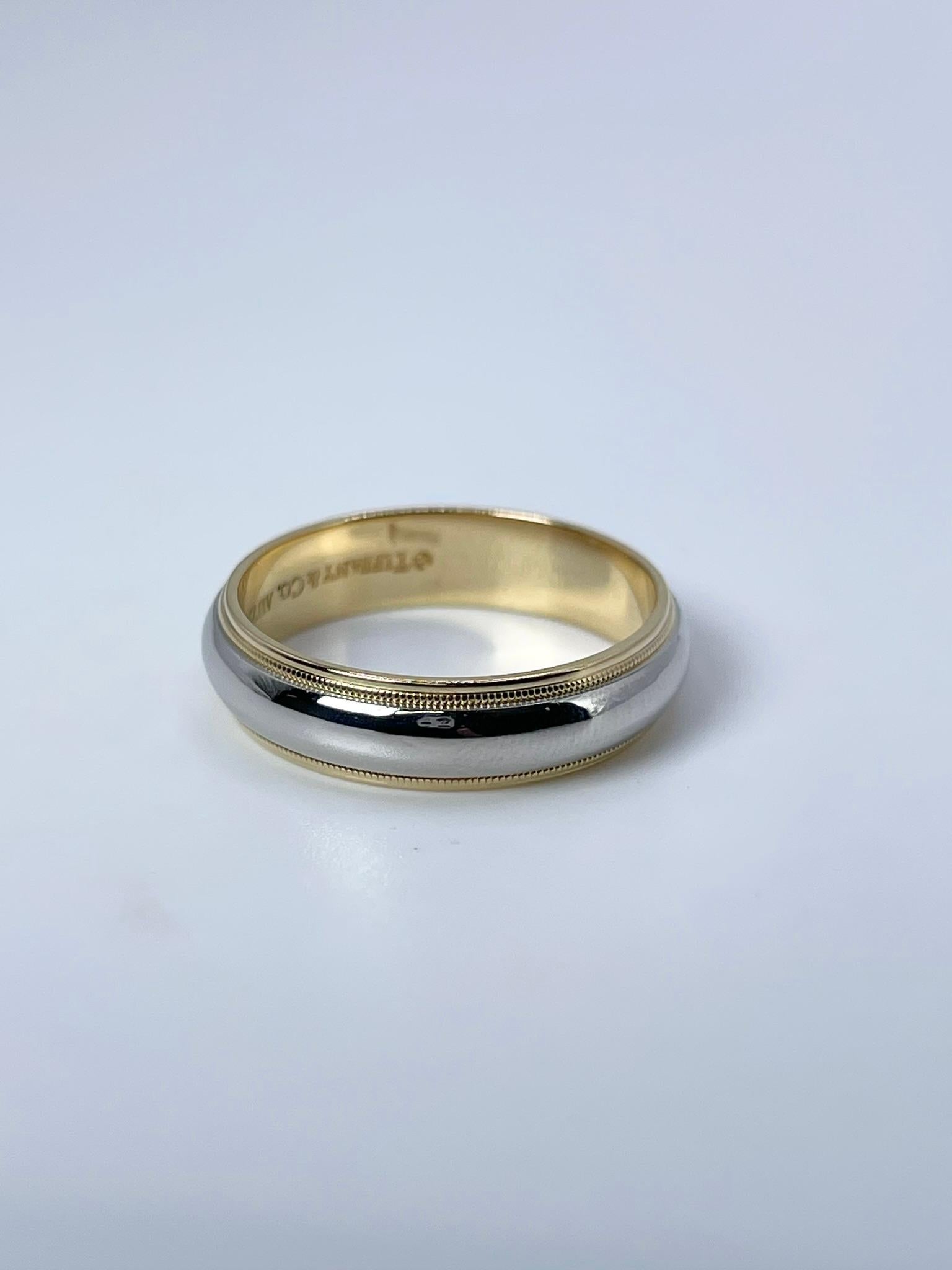 Tiffany & Co. wedding band in 18KT white and yellow gold.
ITEM: PTE 405-00002
GRAM WEIGHT: 11.73gr
GOLD: 18KT gold
SIZE: 12.5
WIDTH:6mm

WHAT YOU GET AT STAMPAR JEWELERS:
Stampar Jewelers, located in the heart of Jupiter, Florida, is a custom