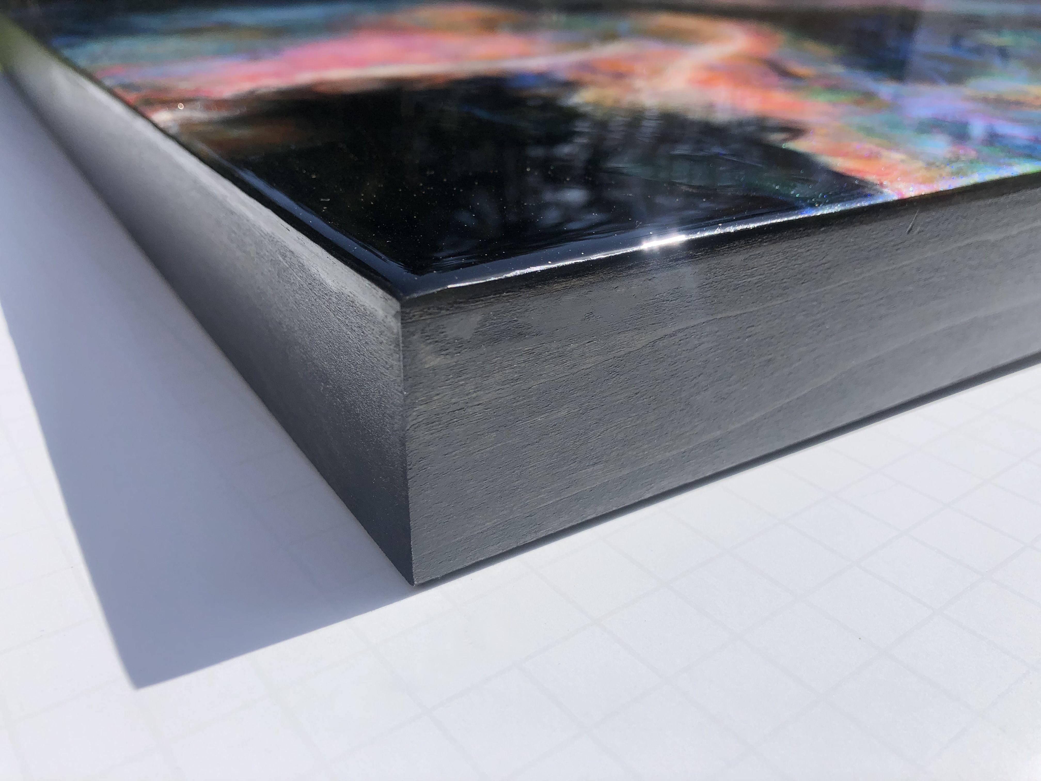 Tiffani employed her holographic resin painting technique to create the ELURIA NEBULA, a stunningly vibrant piece of resin art that captures the imagination and wonder of stargazing with its vivid colors and swirling, cosmic patterns. Like a