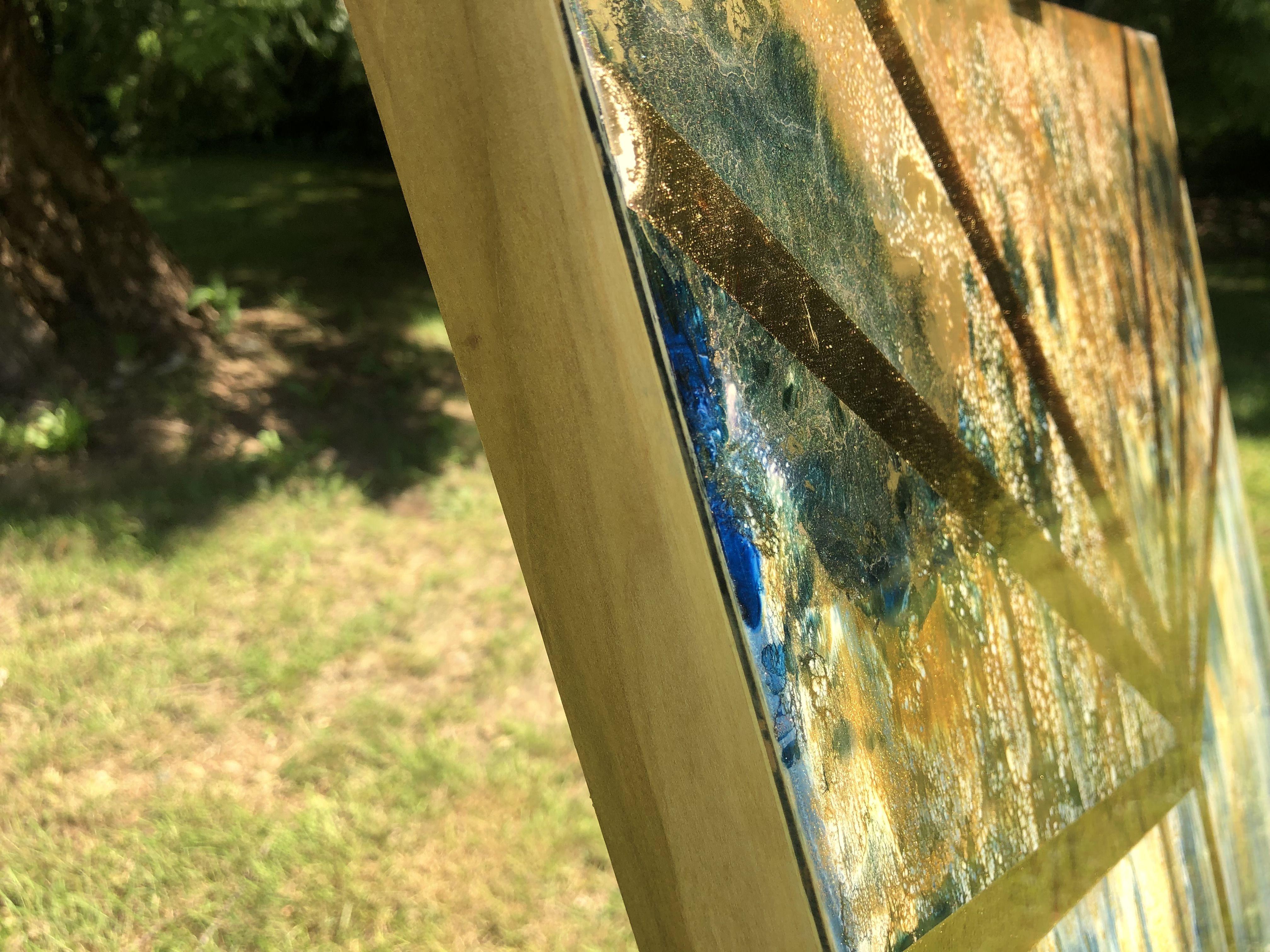 The Making of GOLDEN HOUR    This abstract was one I created dynamically and in the moment. Resin cures quickly so when I make dynamic paintings I have to move fast. Working with a large blade and several pigmented cups of resin, I intermixed the