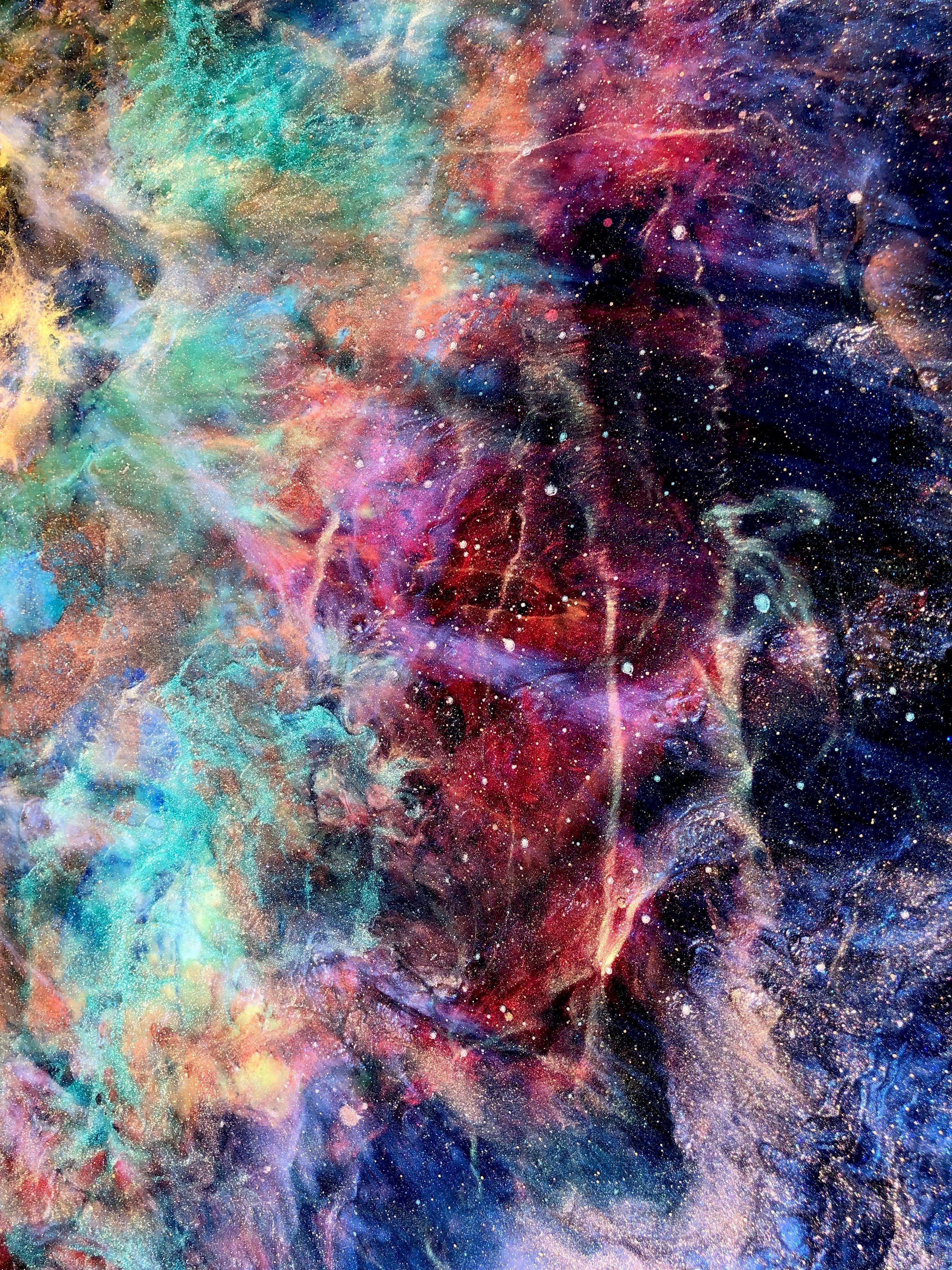 The PLEIARA NEBULA was made using TIffani's signature layered holographic resin painting technique for a nebula scene bursting with life. The top layer features interference pigments that shift tones in different lights, almost disappearing in