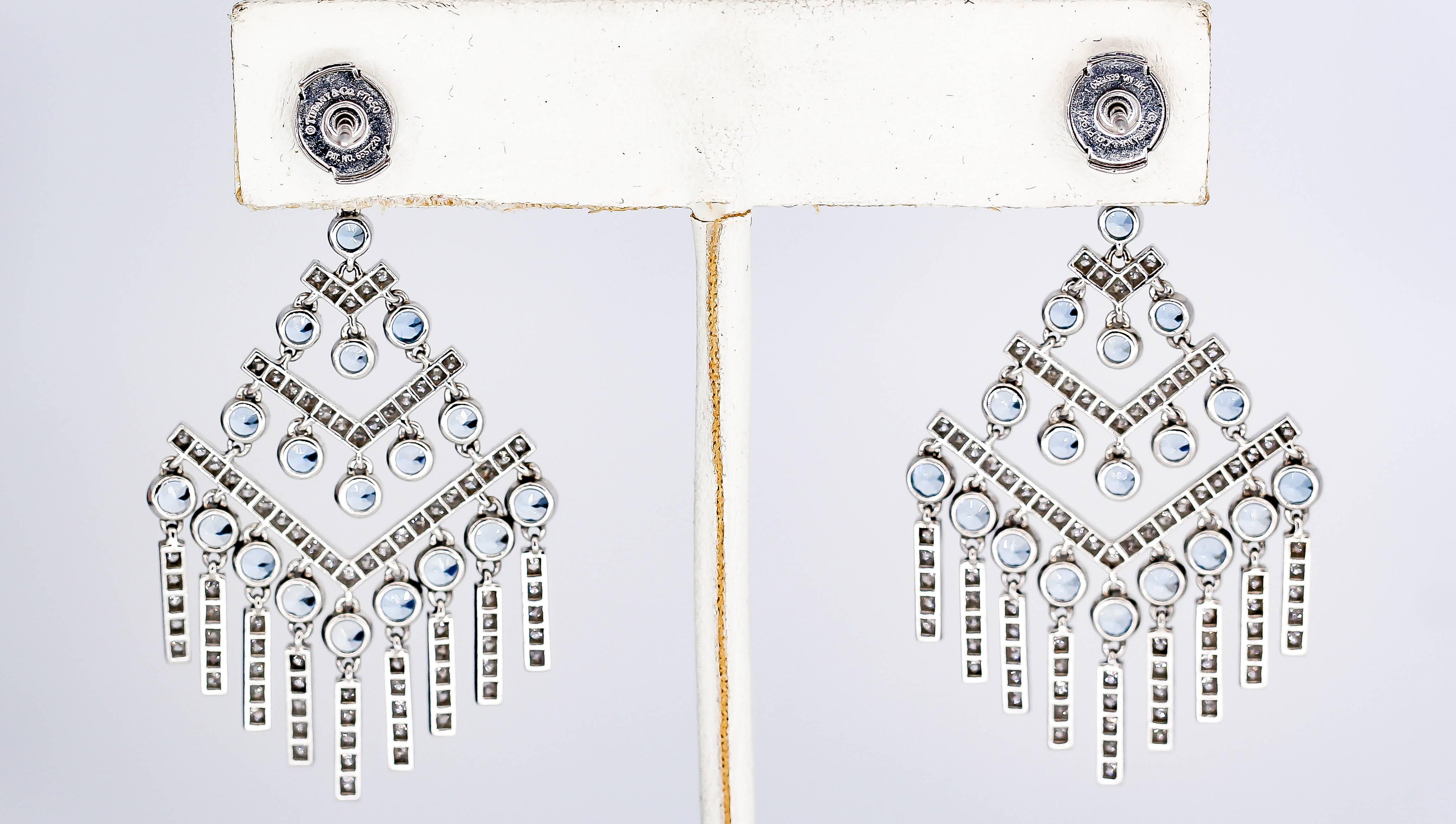 Pretty diamond, aquamarine and platinum chandelier earrings by Tiffany & Co. The earrings come from the Jazz Chevron collection by Tiffany, circa 2016-17. They feature round cut aquamarines of approx. 3-4 carats total weight, along with high grade