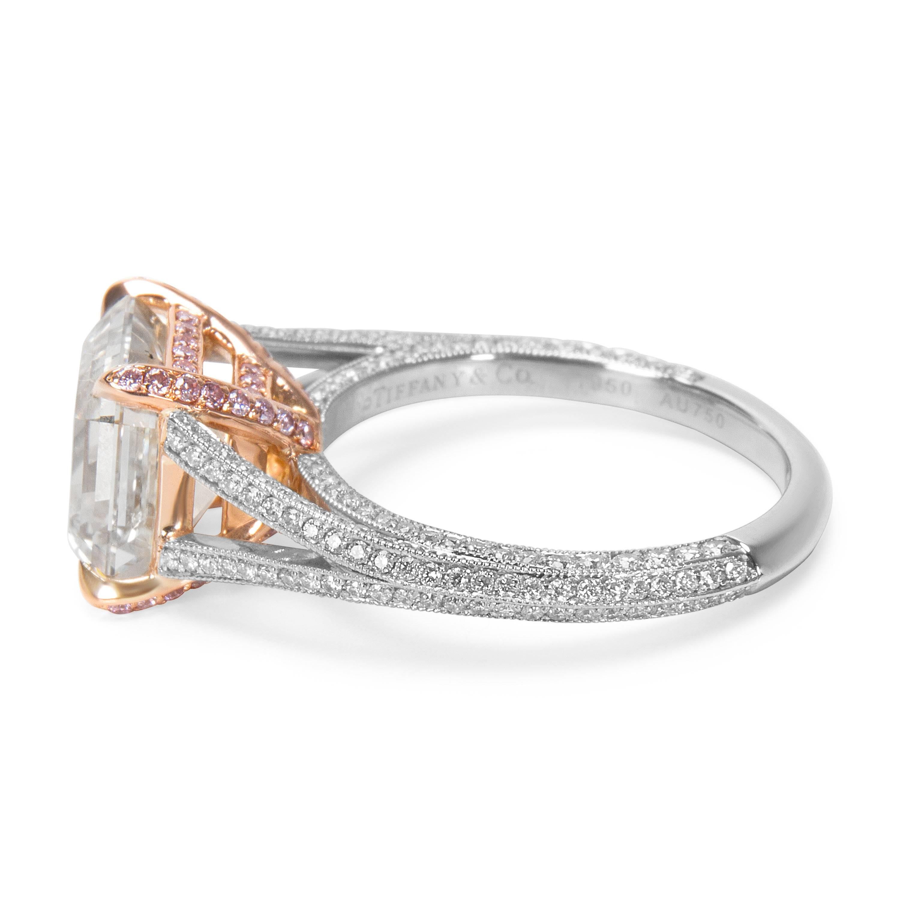 This stunning Tiffany & Co. engagement ring features a 3.28 carat asscher cut diamond, G in color and VS1 in clarity. There are 0.40 carats of white diamonds lining the platinum band and 0.16 carats of fancy pink diamonds on the rose gold basket.