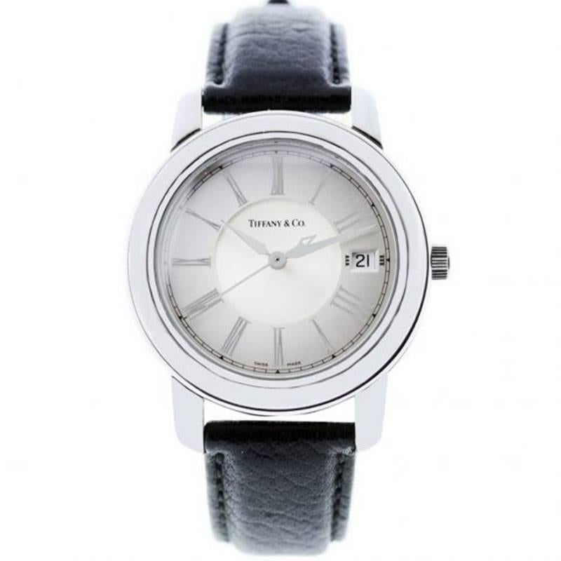 Brand: Tiffany & Co.
Model: Atlas
Case Material: Stainless Steel
Case Diameter: 37mm
Crystal: Scratch resistant sapphire
Bezel: Stainless Steel Bezel, Fixed
Dial: White roman dial. Date is displayed at 3 o’ clock.
Bracelet: Black Leather
Size: 8.25″