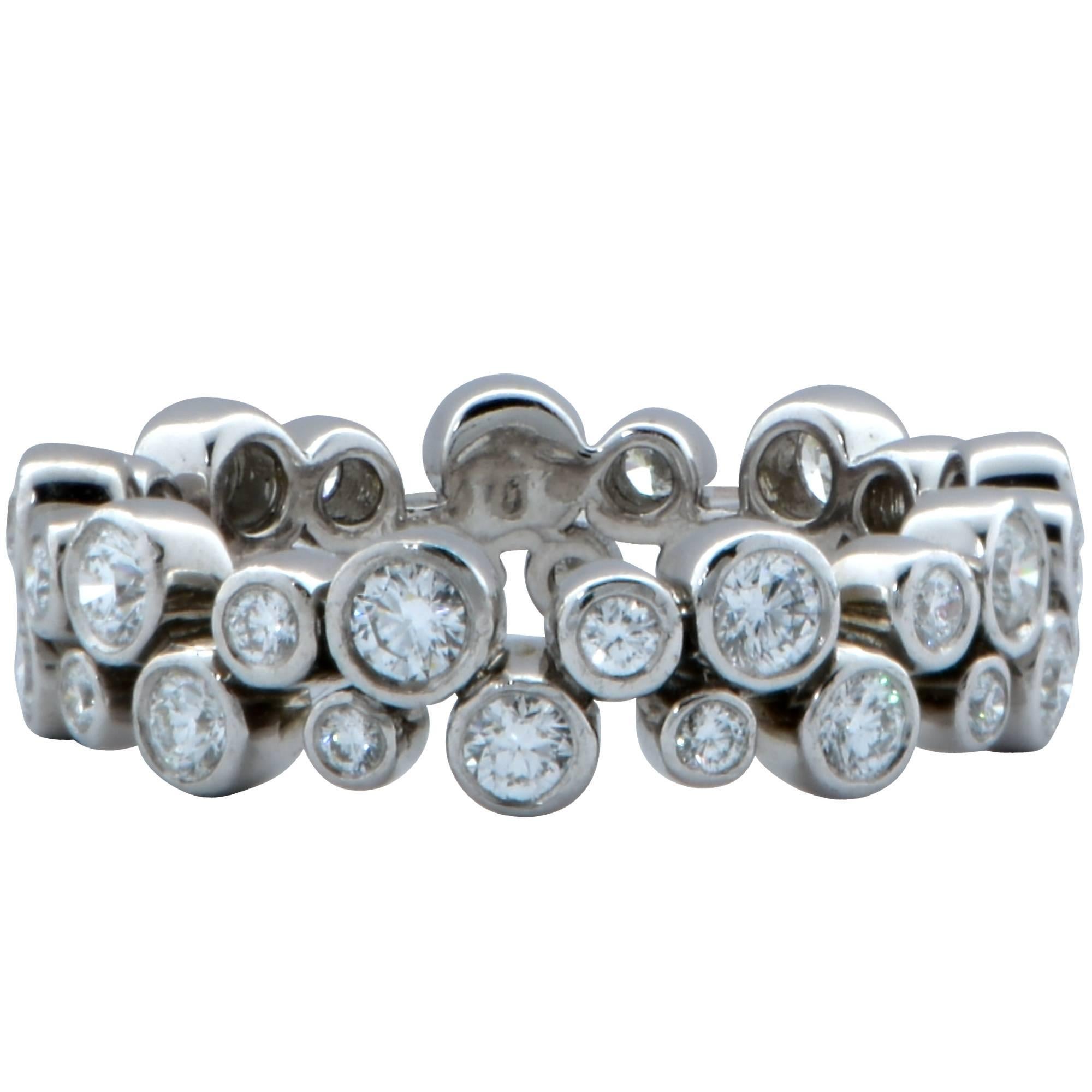 A fabulous creation from the bubbles collection, this band features 36 round brilliant cut diamonds weighing approximately 1 carat total, F color, VVS1-VVS clarity. Crafted in platinum 950, this ring exudes Tiffany & Co.’s spectacular